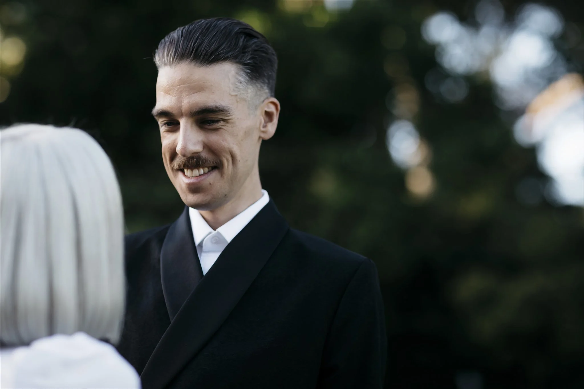 Bride and groom during ring exchange at Melbourne elopement ceremony
