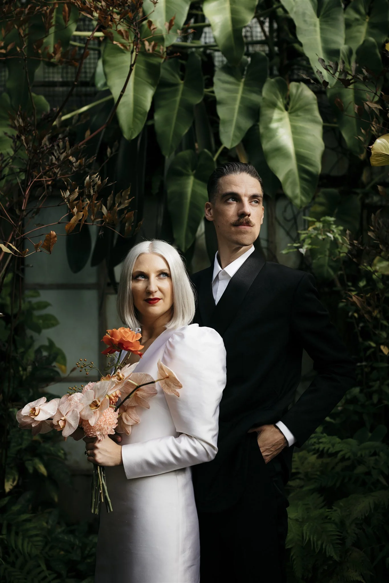 Bride and Groom posing for photos at The Royal Botanic Gardens, Melbourne