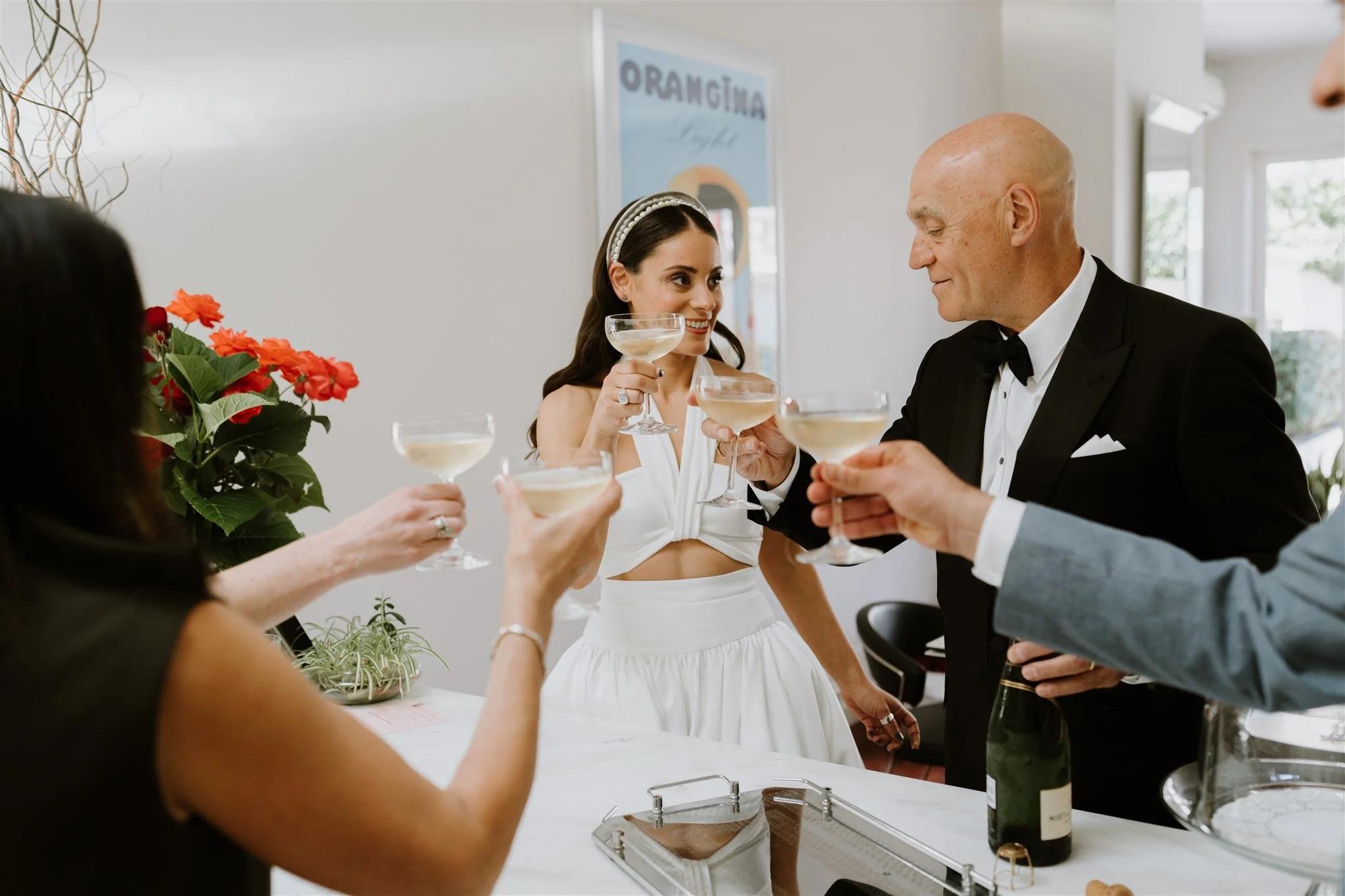 nick-lara-panama-dining-room-wedding-elsa-campbell-cheers-champagne.jpg