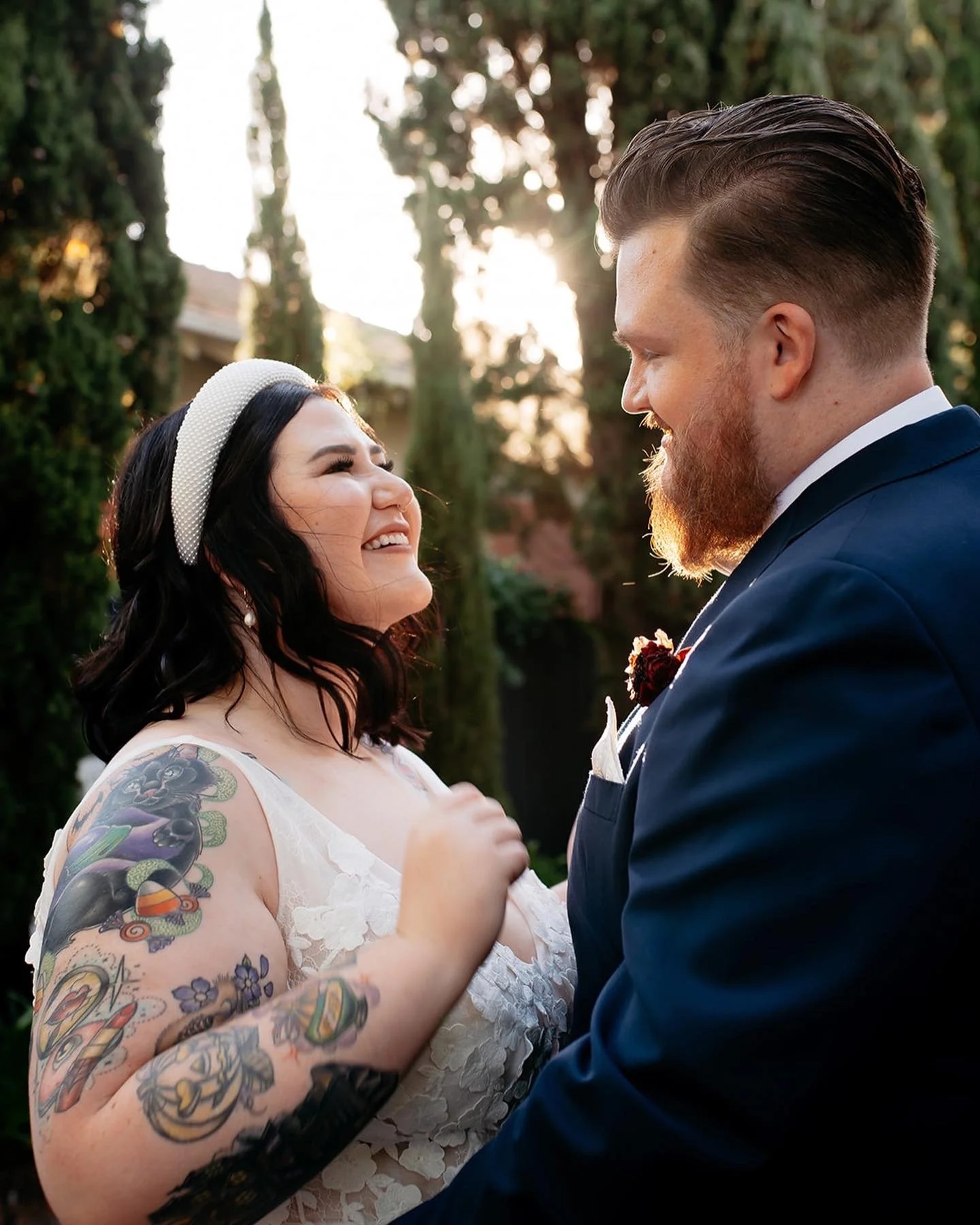 Lisa smiling, tattoos on show, as she embraces her husband Braydon