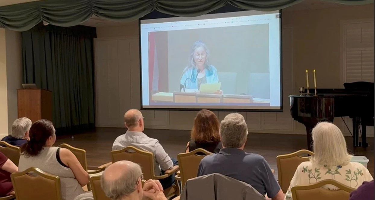 Members of the Kol Shira community watch from Austin as Cantor Gostein addresses the Reform Temple of Forest Hills, New York, with words of gratitude for their Sefer Torah donation.