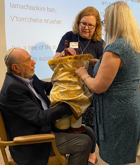 Kol Shira community members dress the Sefer Torah during the Torah dedication service in Austin, Texas.