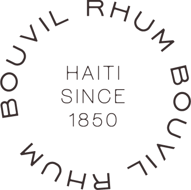 Text reading "Boulderville Rum Haiti Since 1850" arranged in a circular pattern.