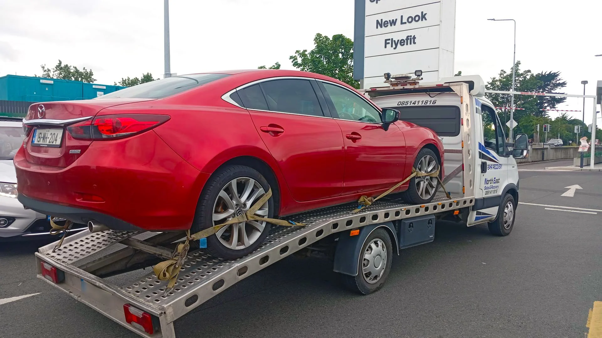 Red Car being recovered