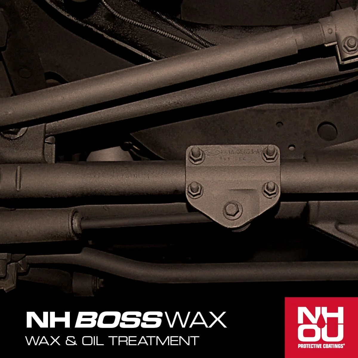 Close-up of a metal vehicle chassis with bolts, tubing, and brackets, promotional banner at the bottom for NH BOSS Wax and Oil Treatment by NHO Protection Coatings.