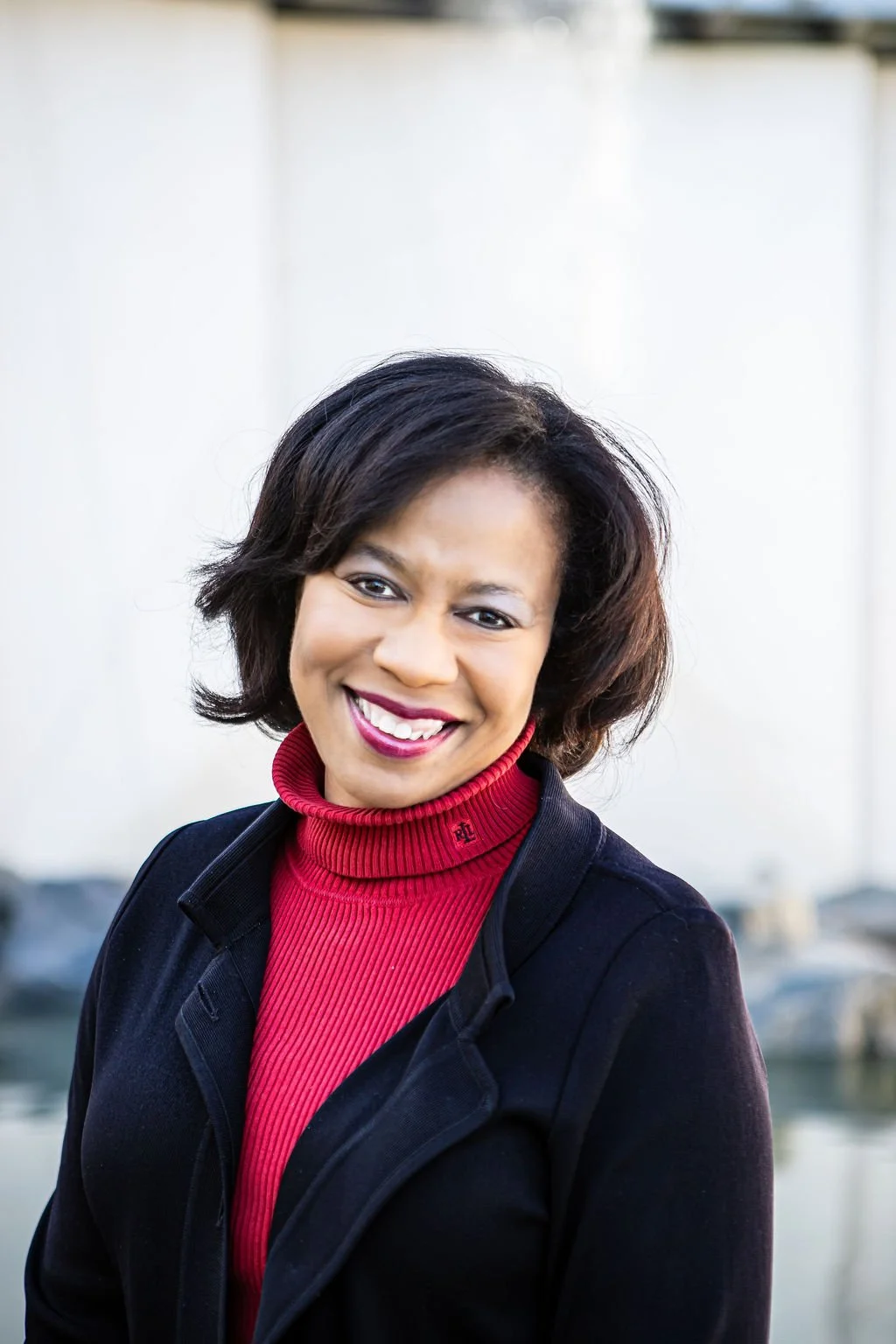 Woman with red turtle neck shirt - Tonya Fryer