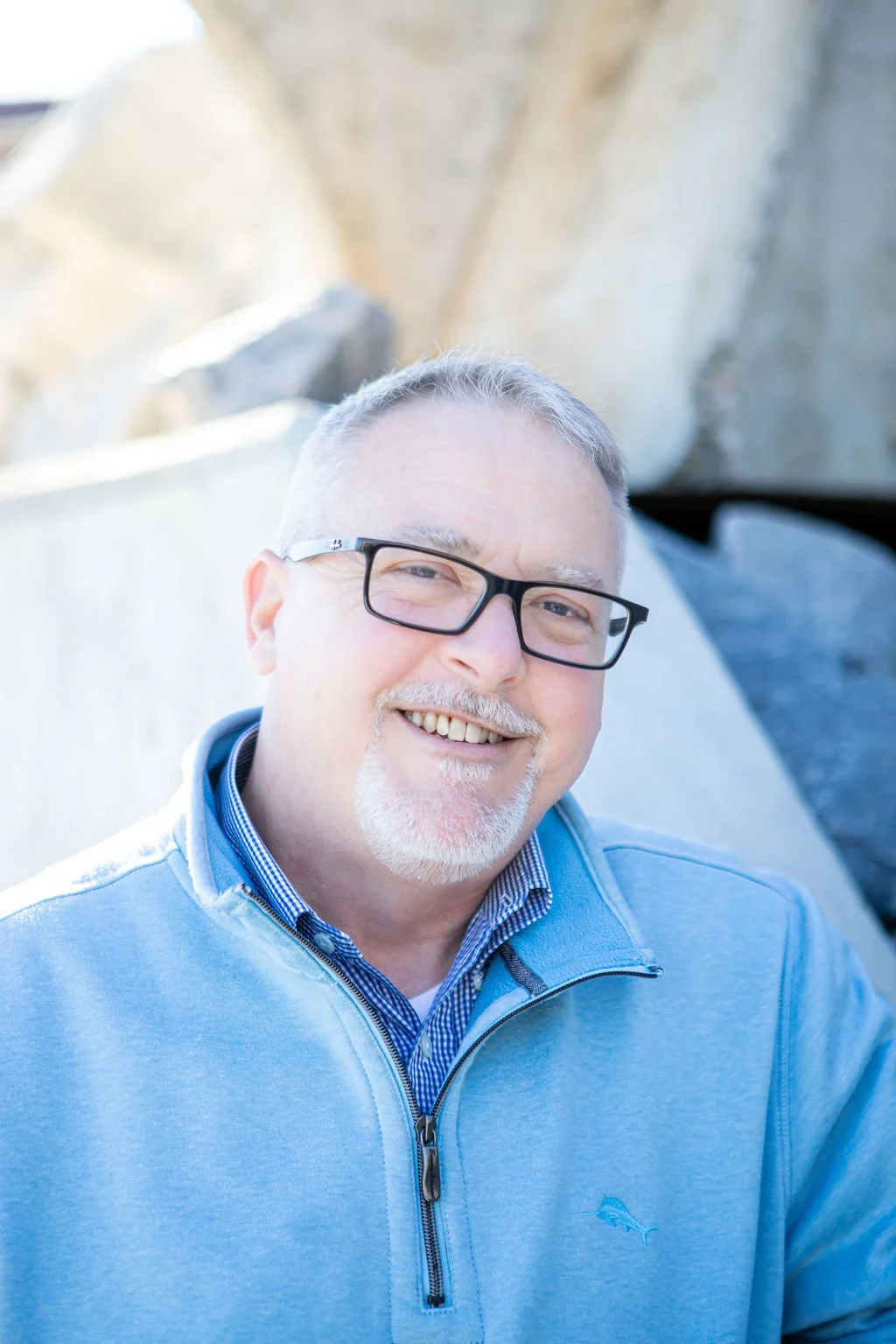 Man with glasses and blue sweater - James McComb