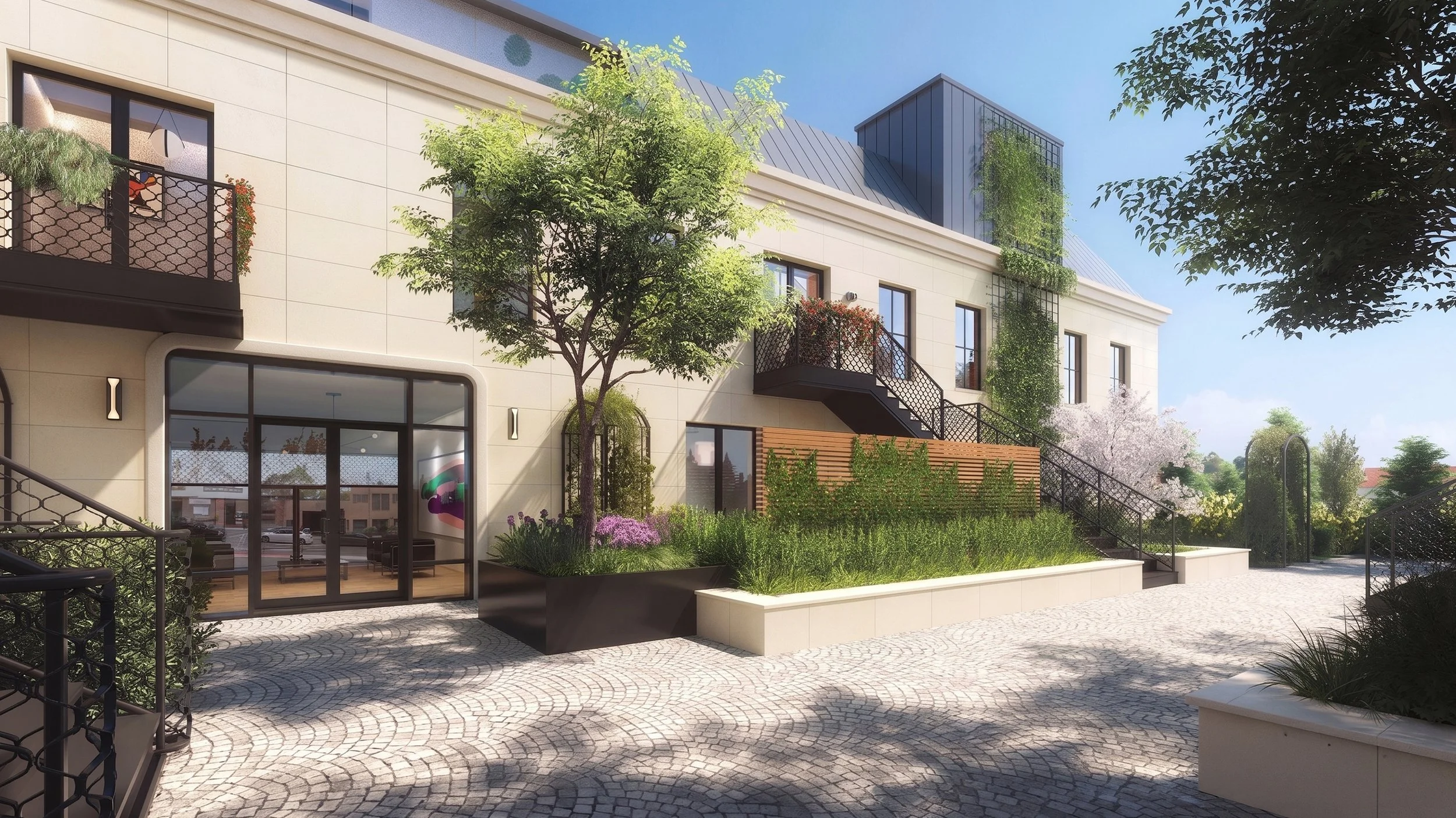A modern residential building with multiple levels, balconies, and outdoor stairs, surrounded by landscaped greenery and people walking or sitting in a courtyard with cobblestone pavement on a sunny day.
