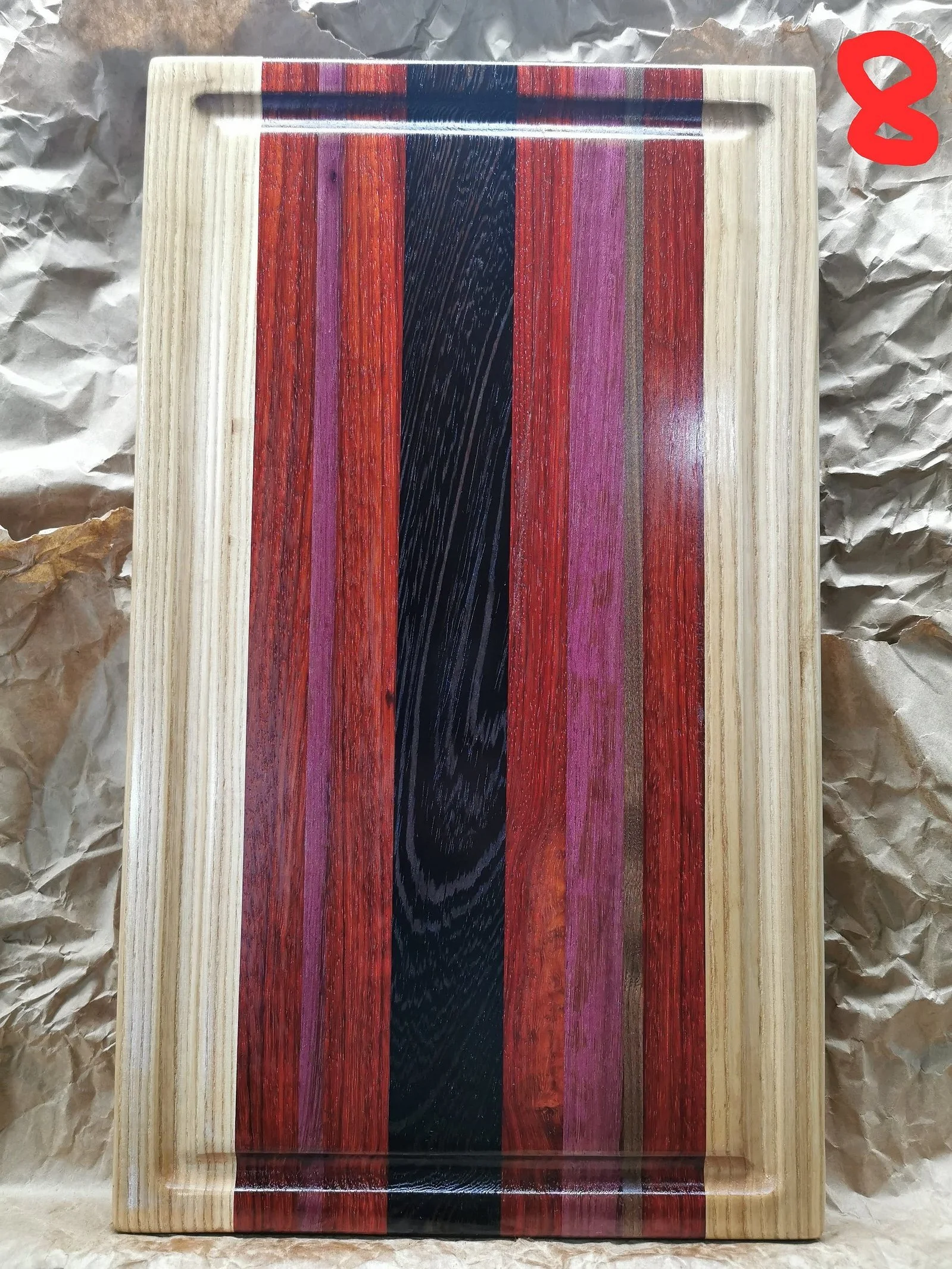 Cutting boards are 100% from hardwood (maple, walnut and ash).
11x18x1.5 inches with inserted handle, juice groove and rubber feet.
Exotic woods included (wenge / purple heart / padauk ).
Name engraving $20 extra.
Customizable to any size and colour