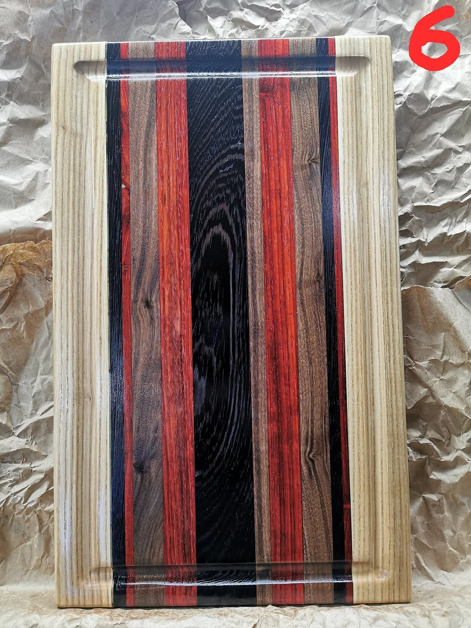 Cutting boards are 100% from hardwood (maple, walnut and ash).
11x18x1.5 inches with inserted handle, juice groove and rubber feet.
Exotic woods included (wenge / purple heart / padauk ).
Name engraving $20 extra.
Customizable to any size and colour