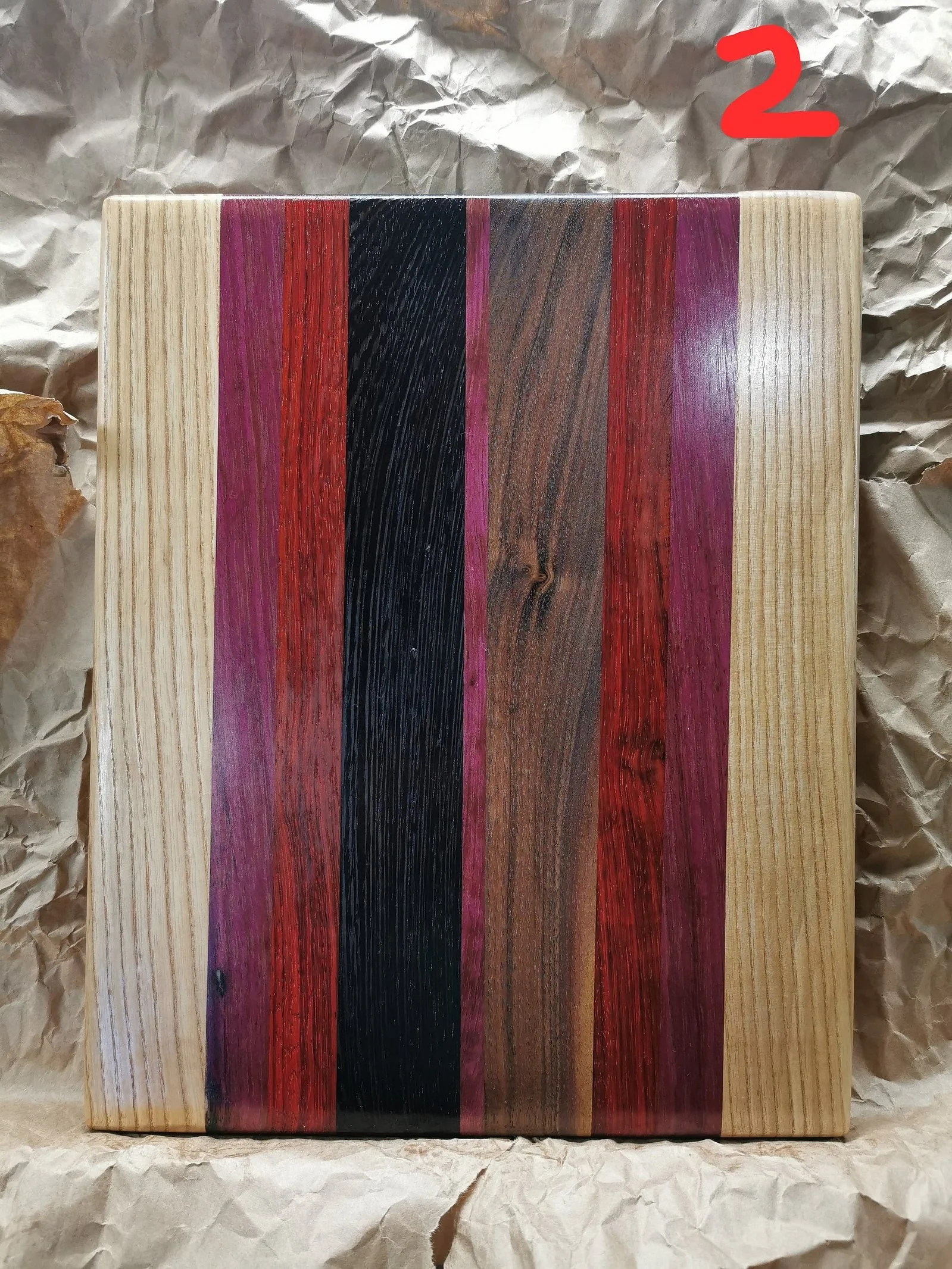 Cutting boards are 100% from hardwood (maple, walnut and ash).
11x14x1.5 inches with inserted handle and rubber feet.
Exotic woods included (wenge / purple heart / padauk ).
Name engraving $20 extra.
Customizable to any size and colour variations.
