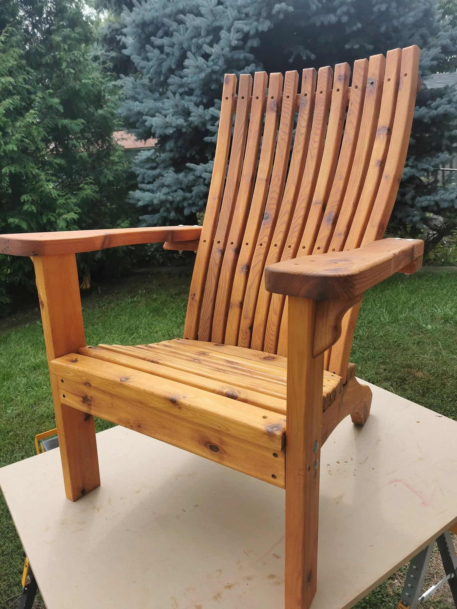 Hand crafted cedar Adirondack chair, stained and finished.