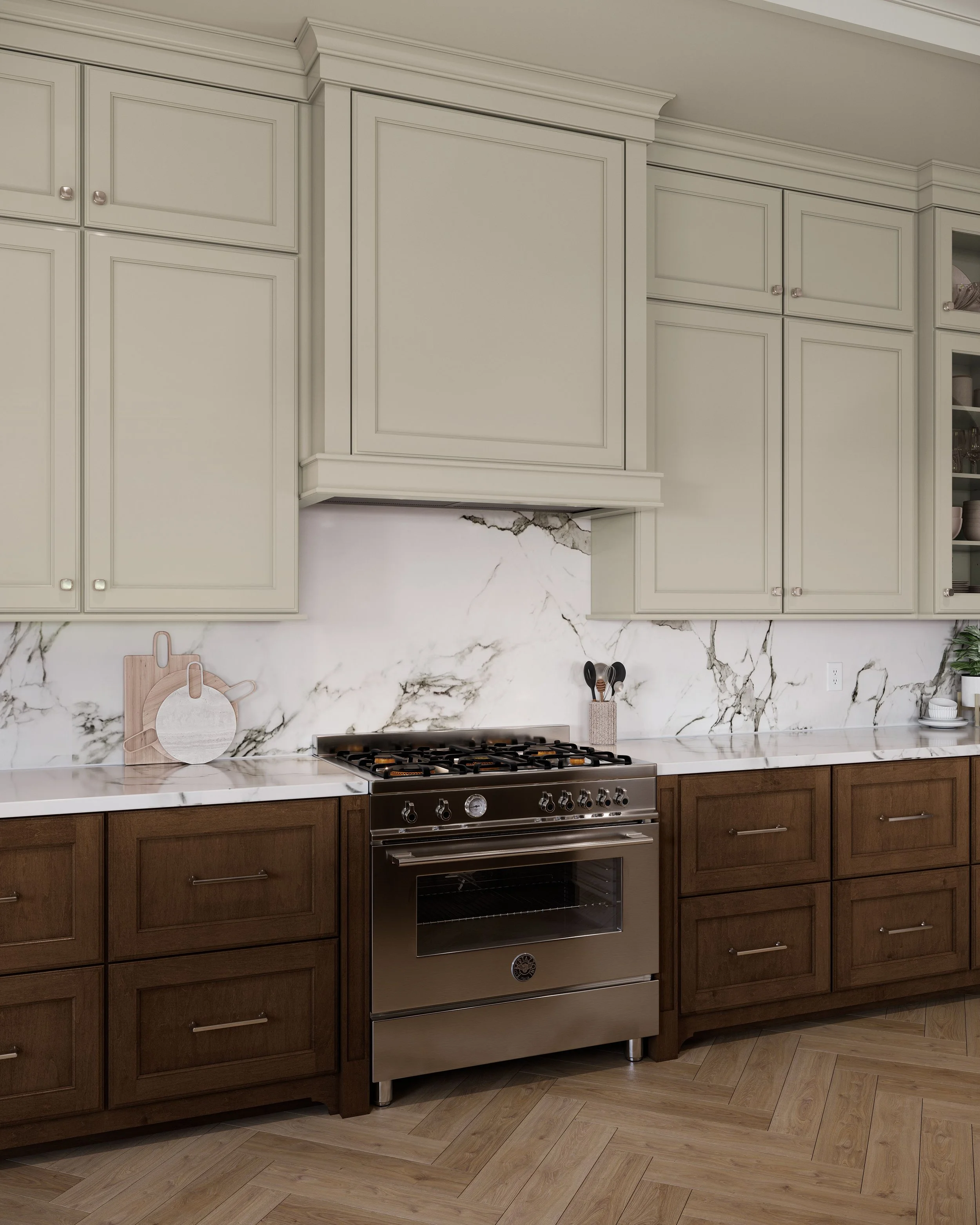 Modern kitchen with white upper cabinets, dark wood lower cabinets, stainless steel stove, marble backsplash and countertops, pizza peels on countertop, and wooden and ceramic dishware.