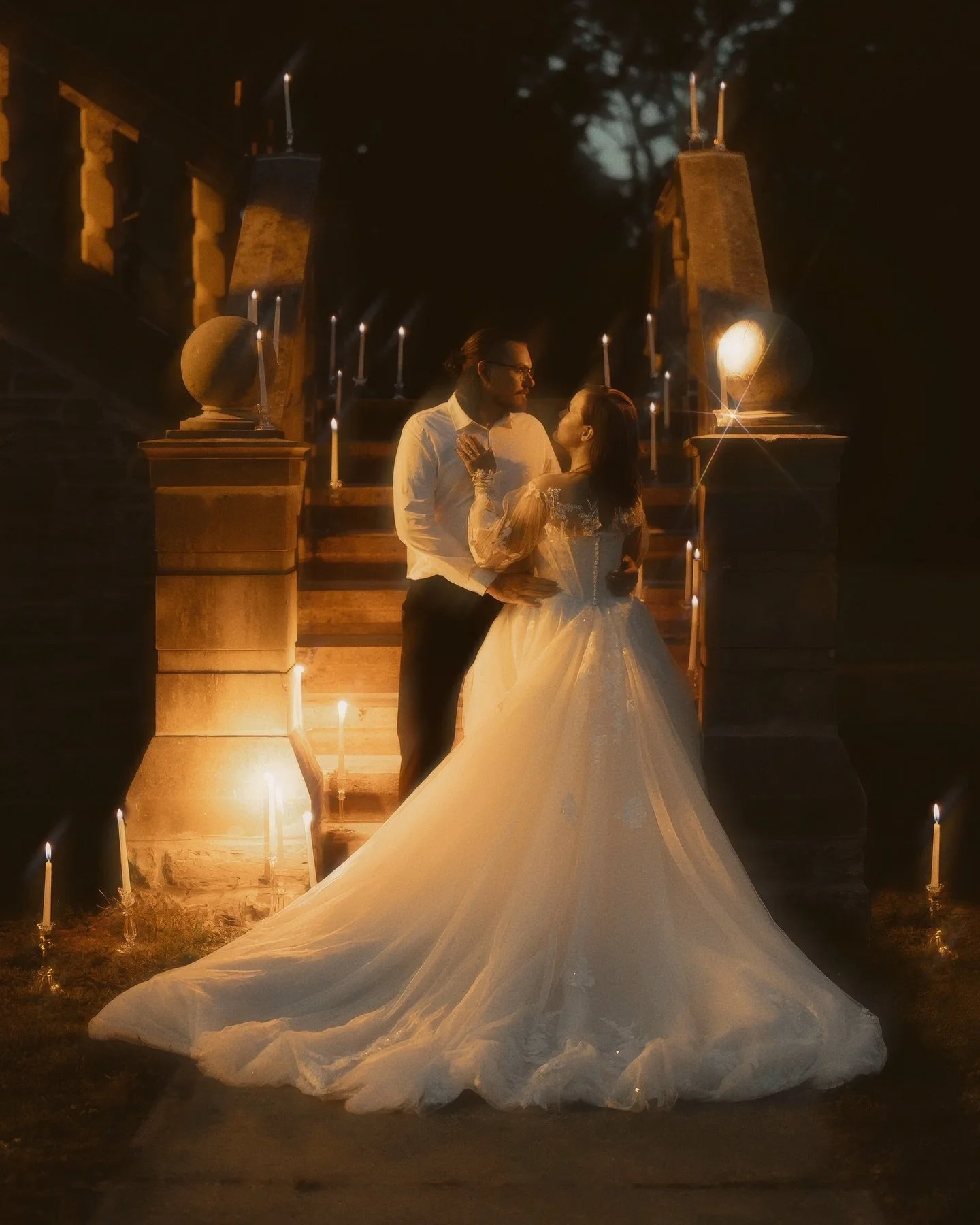 Between stone and silence,
they meet,
not in haste,
but in the hush
of candlelight breathing.

Her gown gathers the night,
his hands remember warmth.
The air hums
with something timeless,
not spoken,
but felt
like a promise already kept.
&bull;
&bull