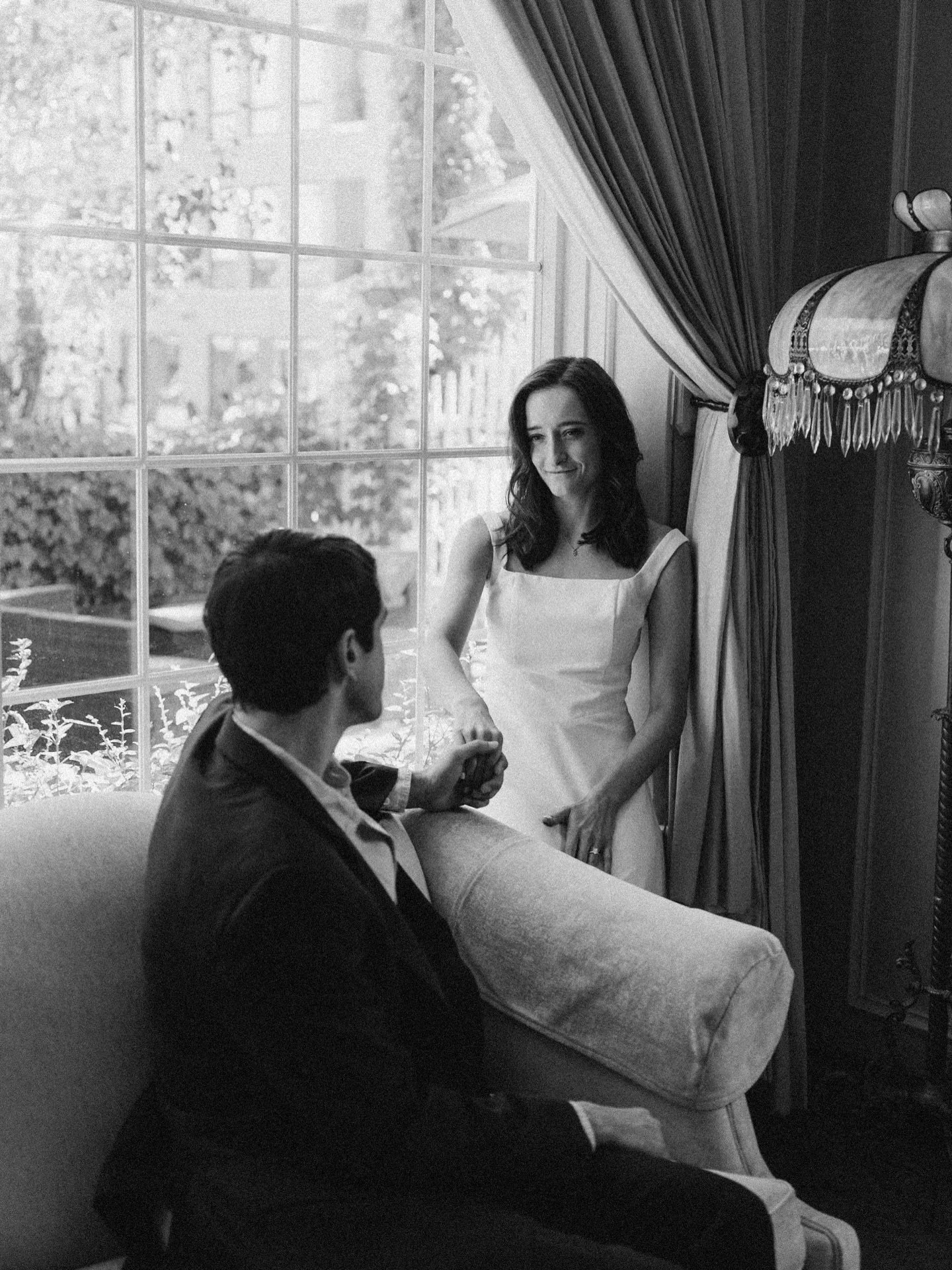 Give me all the old-world charm, ornate details, and that soft window light pouring in like this. The way they sit so effortlessly together. Classic, composed, completely in love.