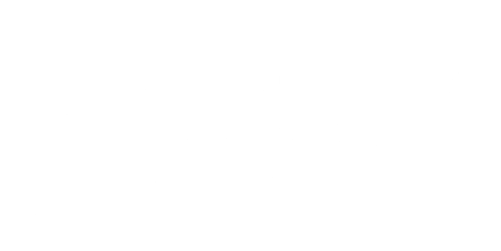 A stack of pancakes topped with whipped cream, strawberries, and a cherry, with syrup drizzled over the top.