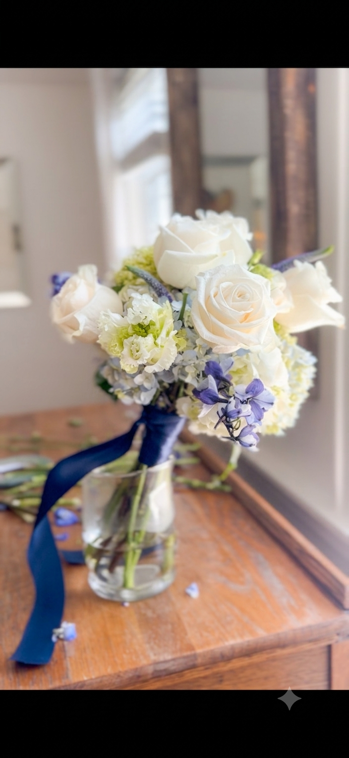 Elegant bridal bouquet with white and blue florals