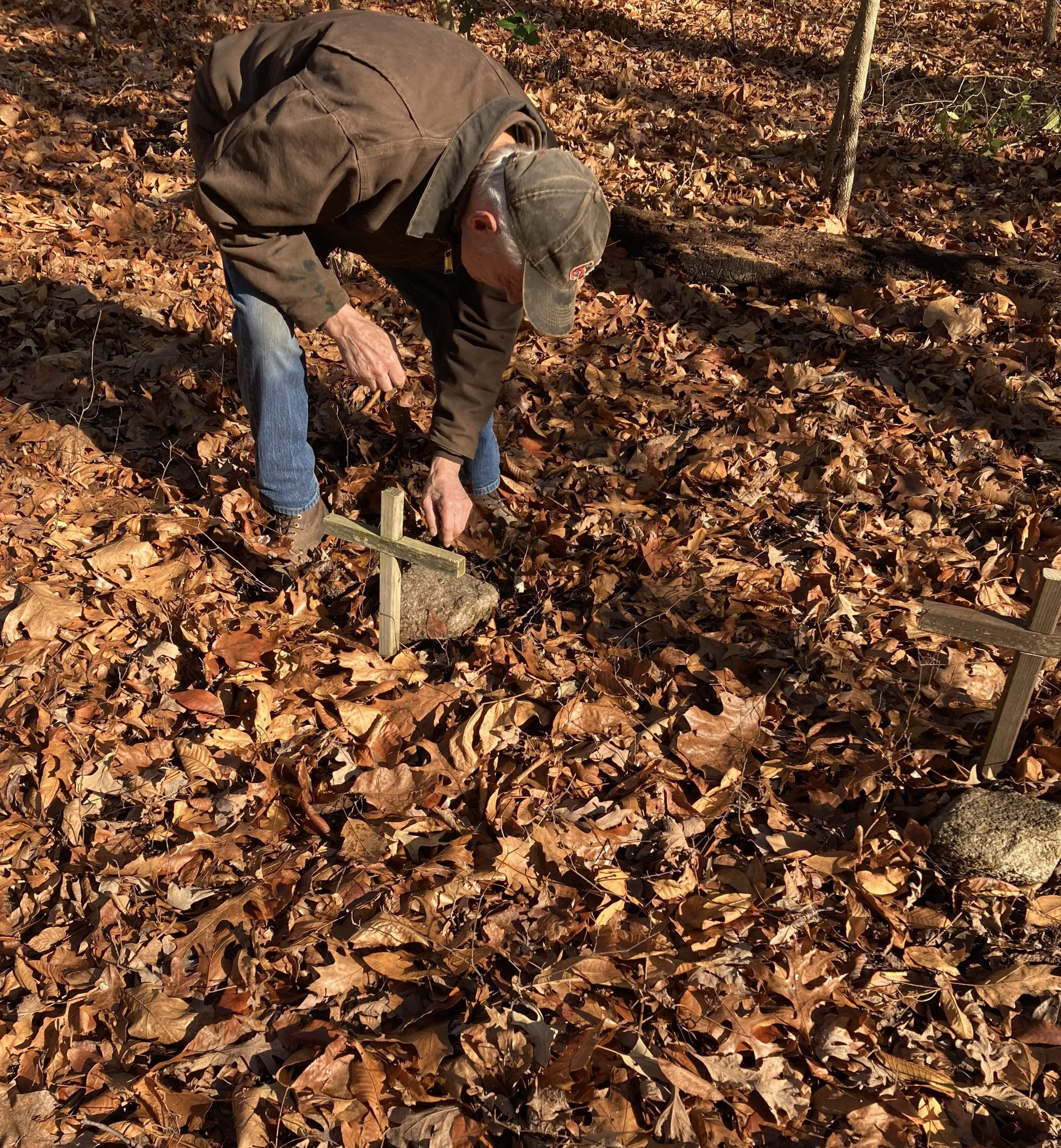 Volunteer Tends Graves.jpeg