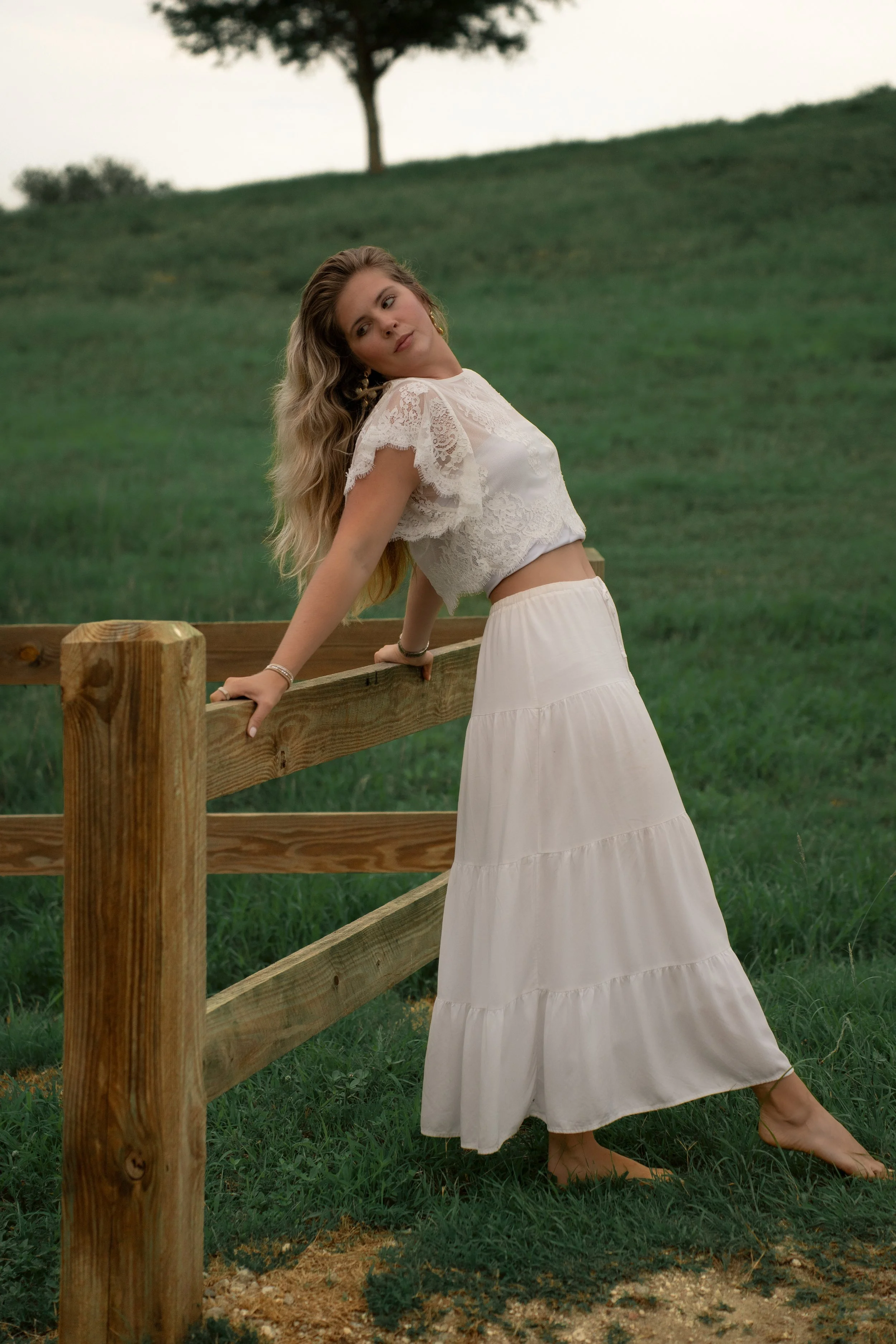 Outdoor portrait beside a wooden fence at Celery Fields in Sarasota, Florida