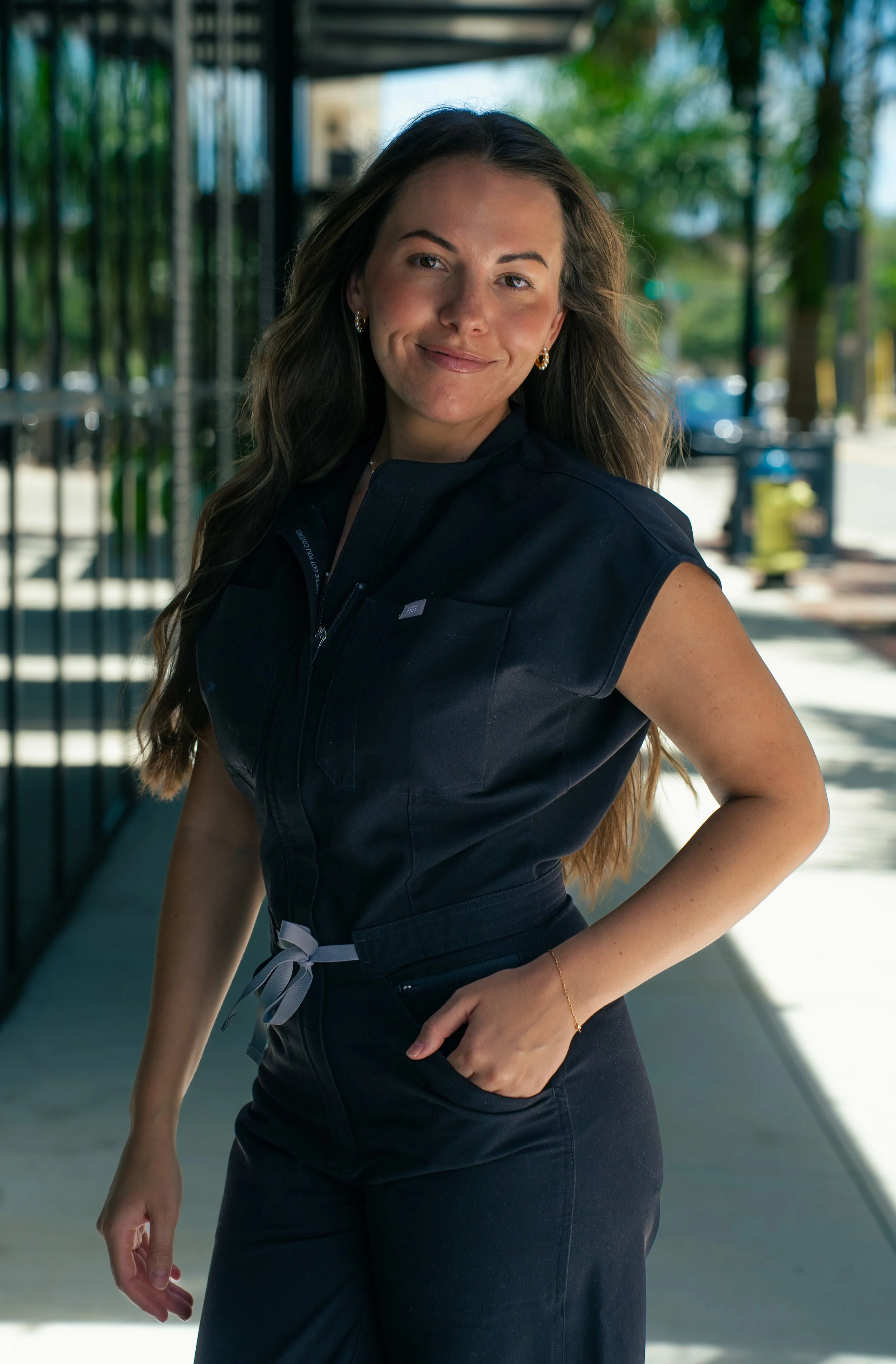 Sarasota aesthetician posing for a professional branding portrait outside her studio.