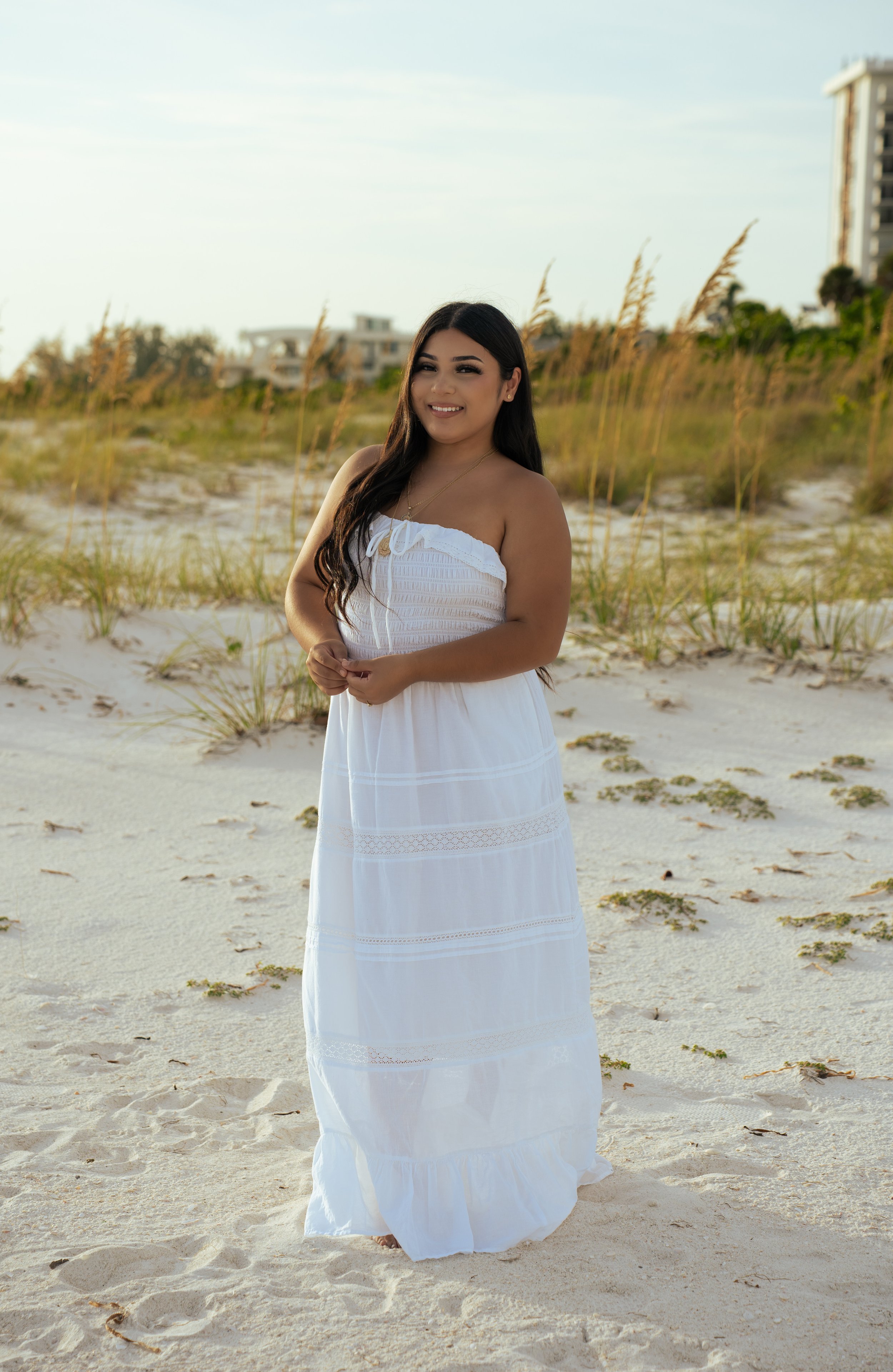 Senior portrait in the dunes at Lido Key Beach in Sarasota Florida