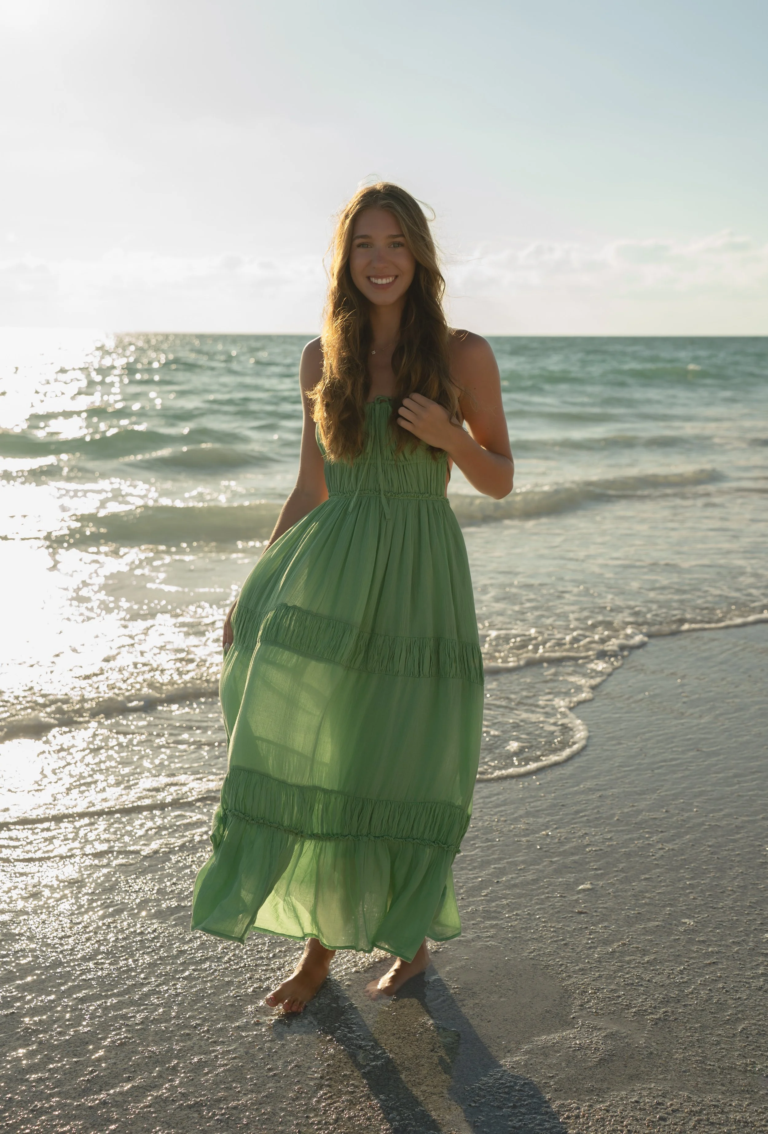 High school senior posing along the shoreline at Bradenton Beach