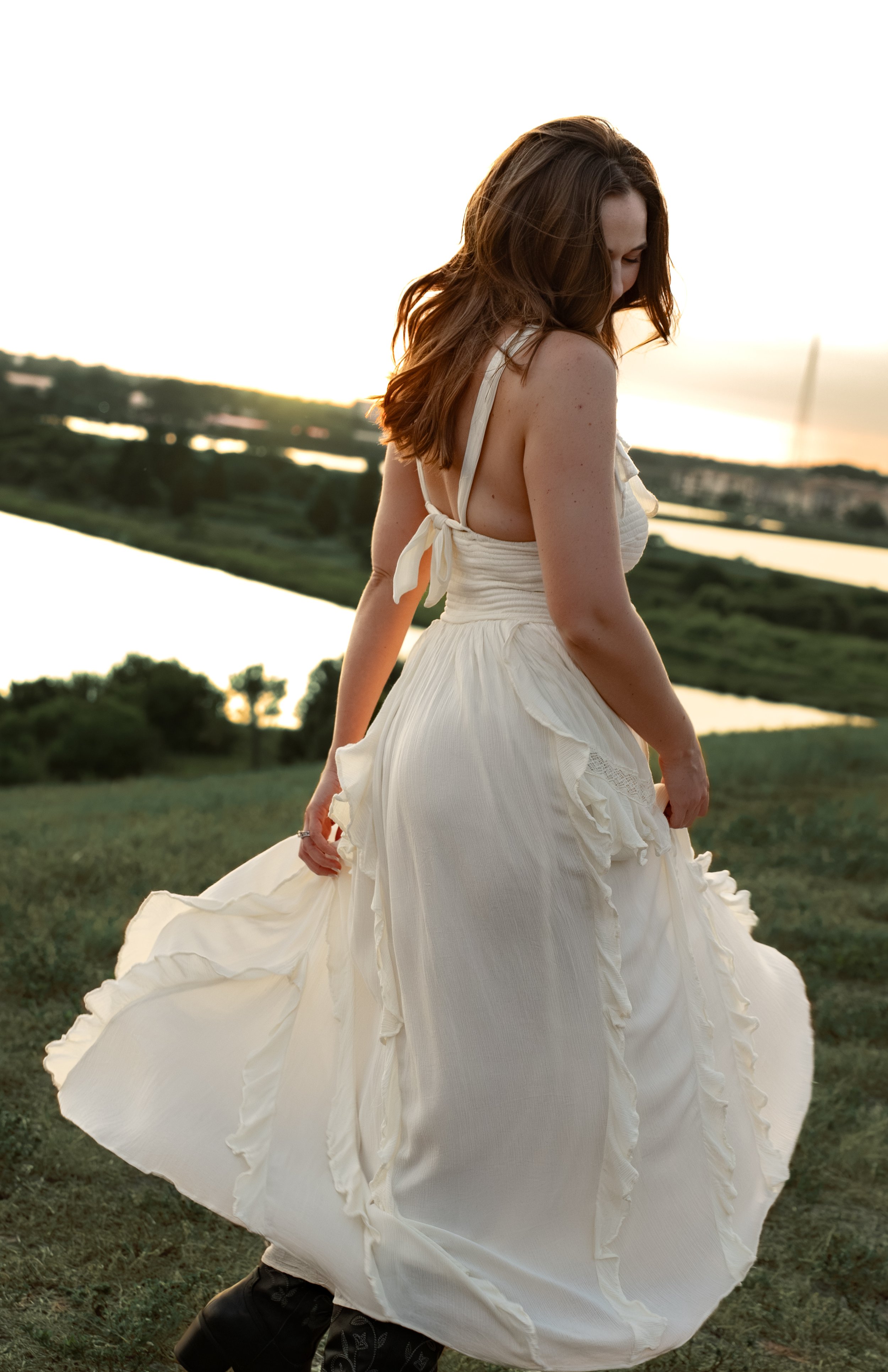 Creative portrait of a woman in a flowing white dress at Celery Fields in Sarasota