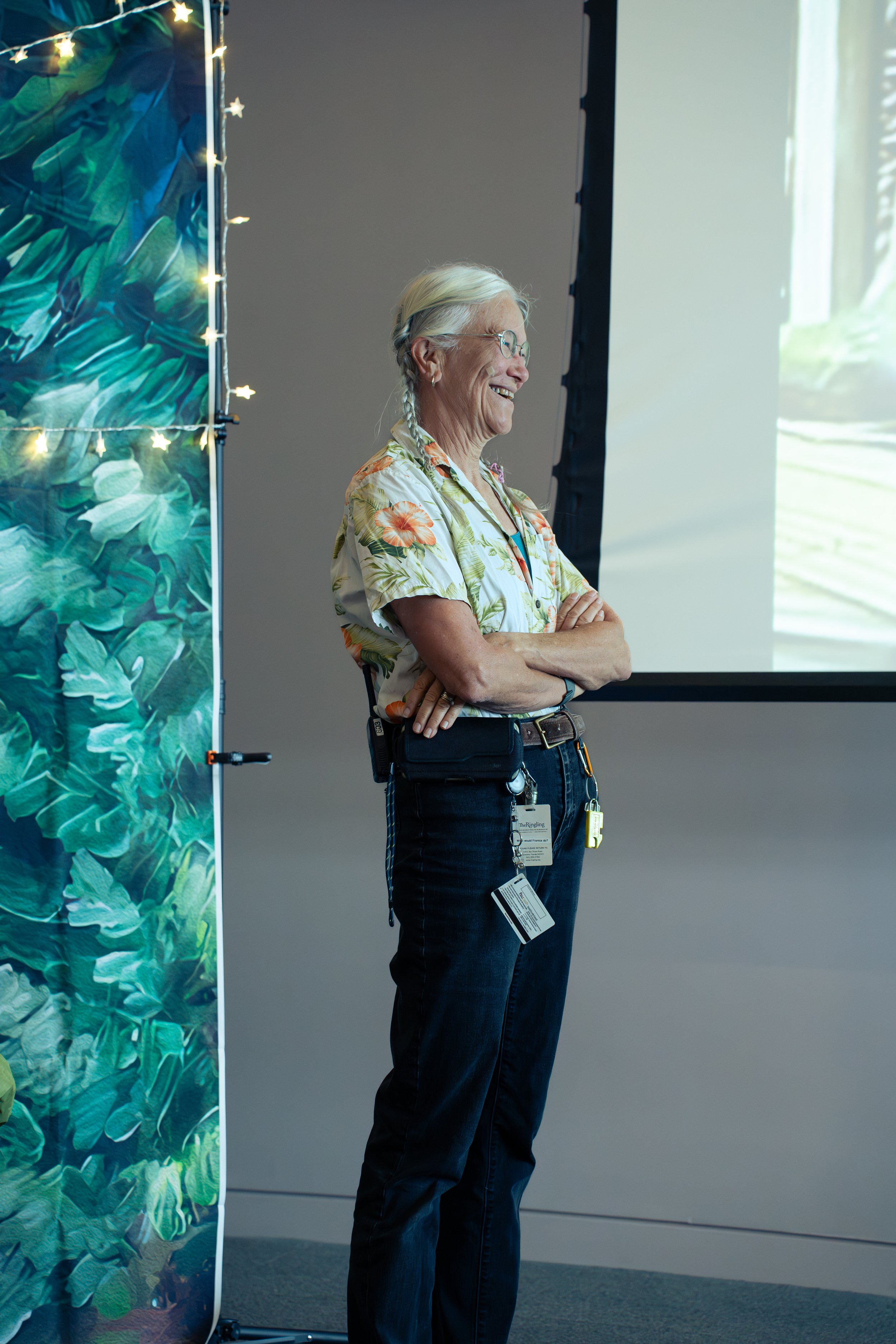 Retiree speaking to colleagues during a surprise retirement celebration in Sarasota.