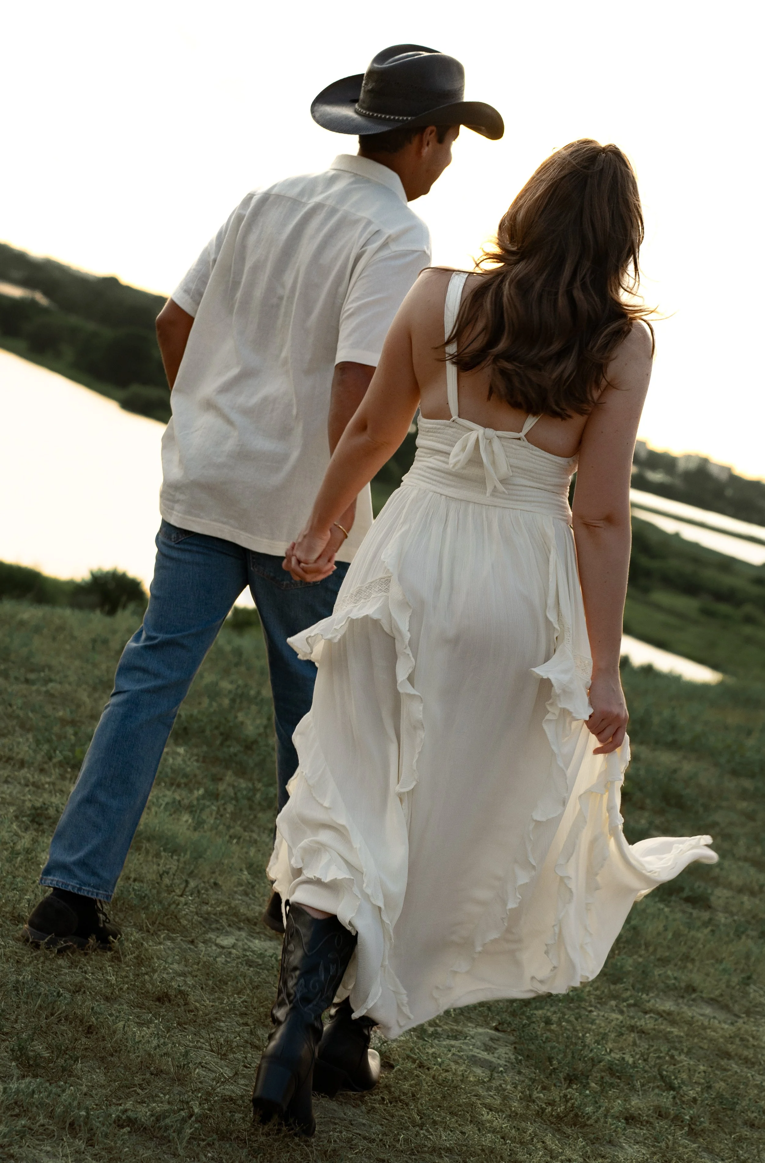 Couple walking hand in hand through Celery Fields during a romantic couples photography session in Sarasota, Florida.