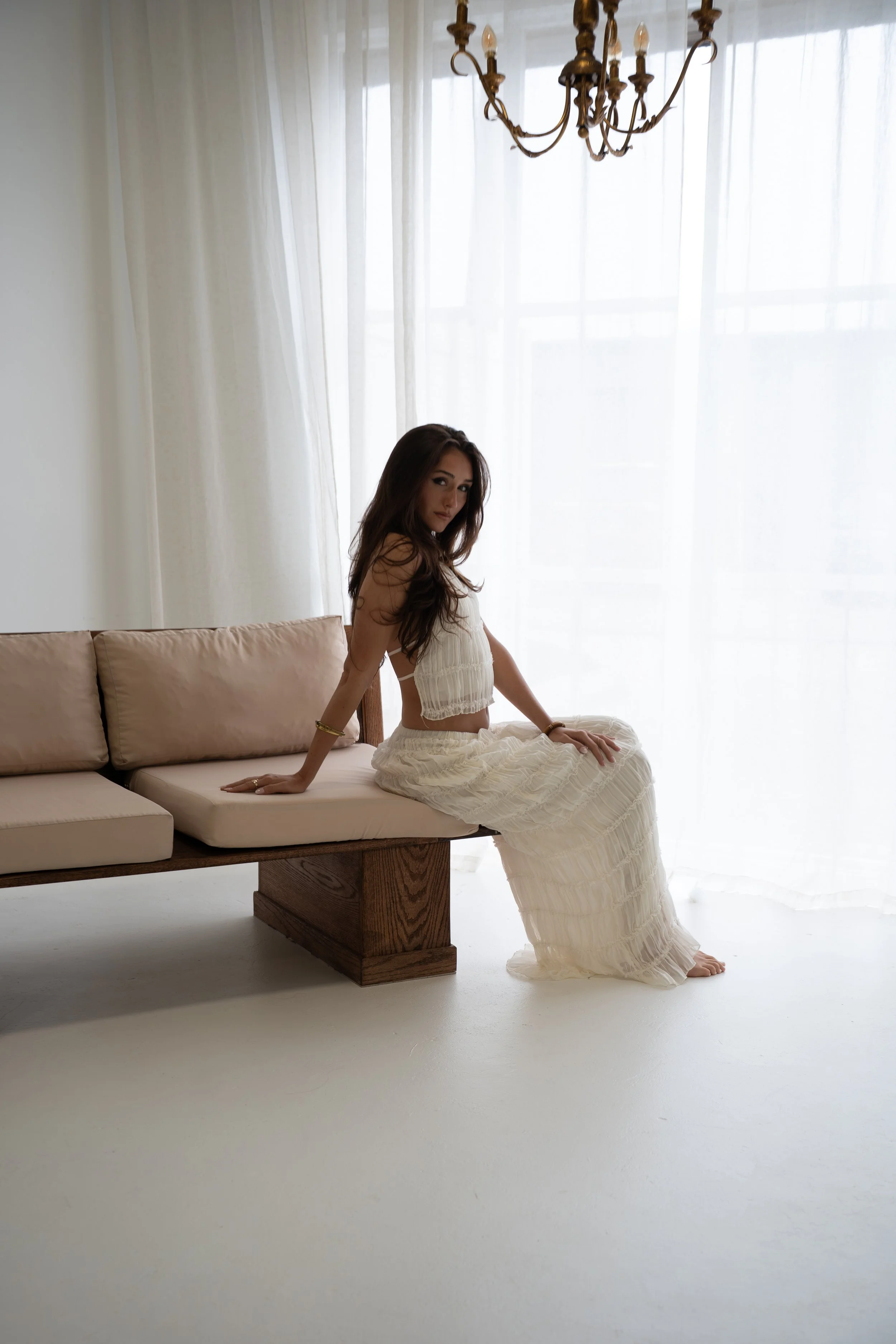 Woman posing in a bright studio during an editorial portrait session in Tampa, Florida