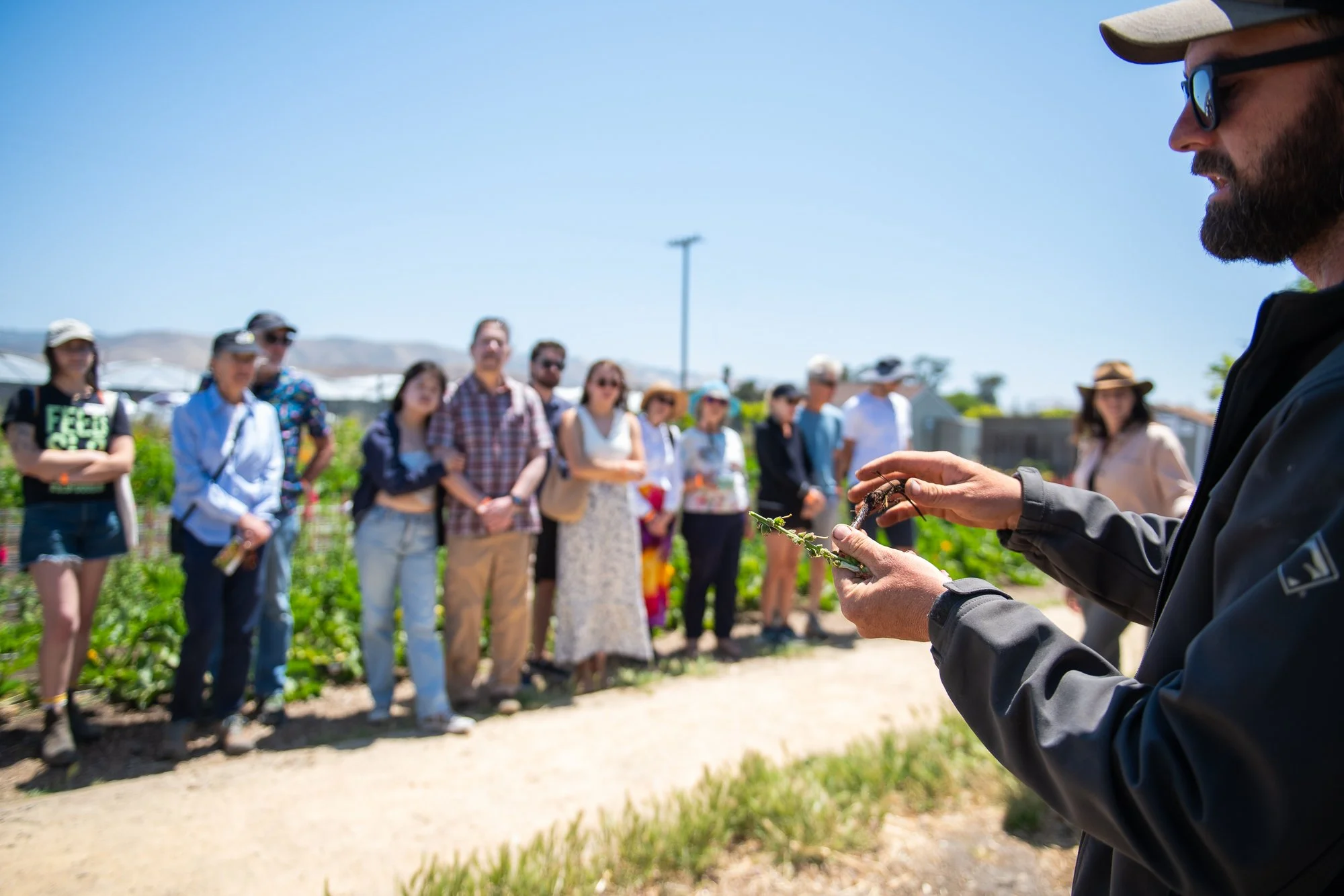 Man leading a farm tour