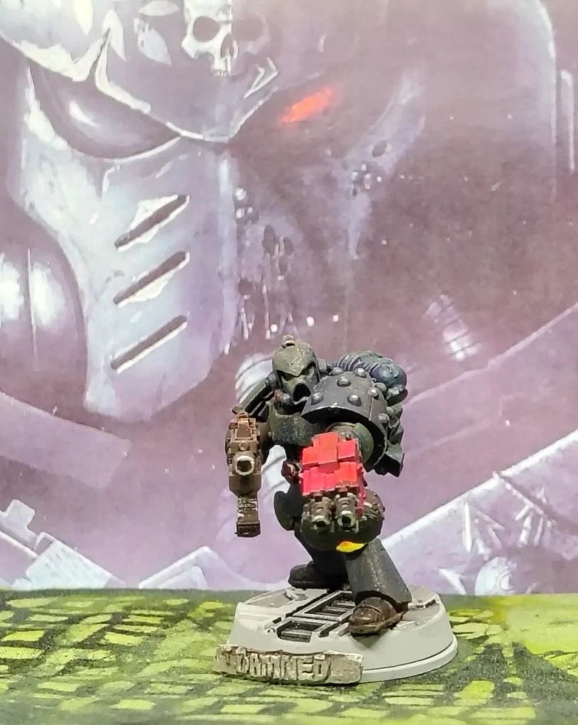 OG Space Marine with 3D added parts stepping up. 