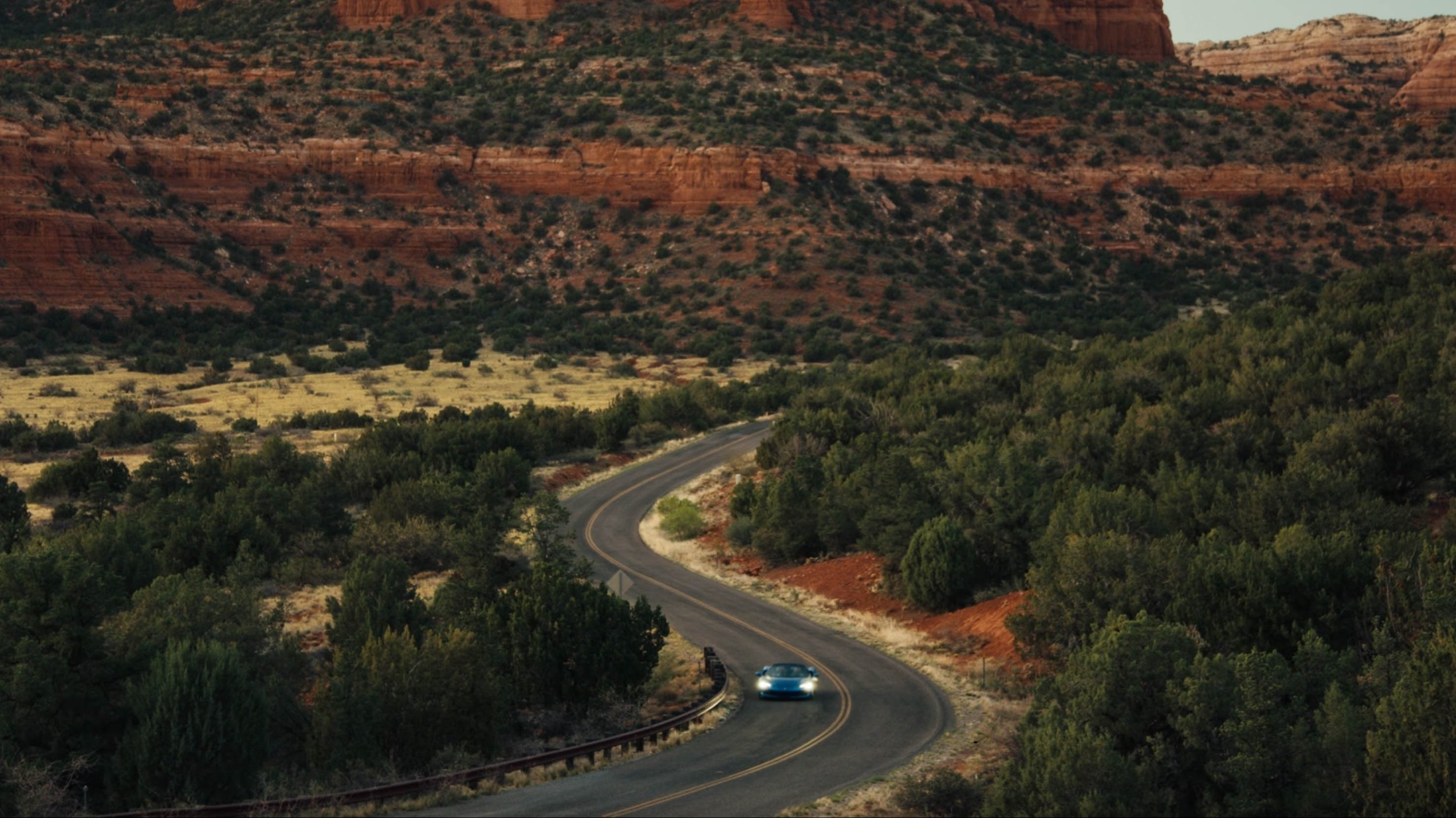 quinn-taplin-ferrari-postcards-aerial-winding-road-desert.jpg