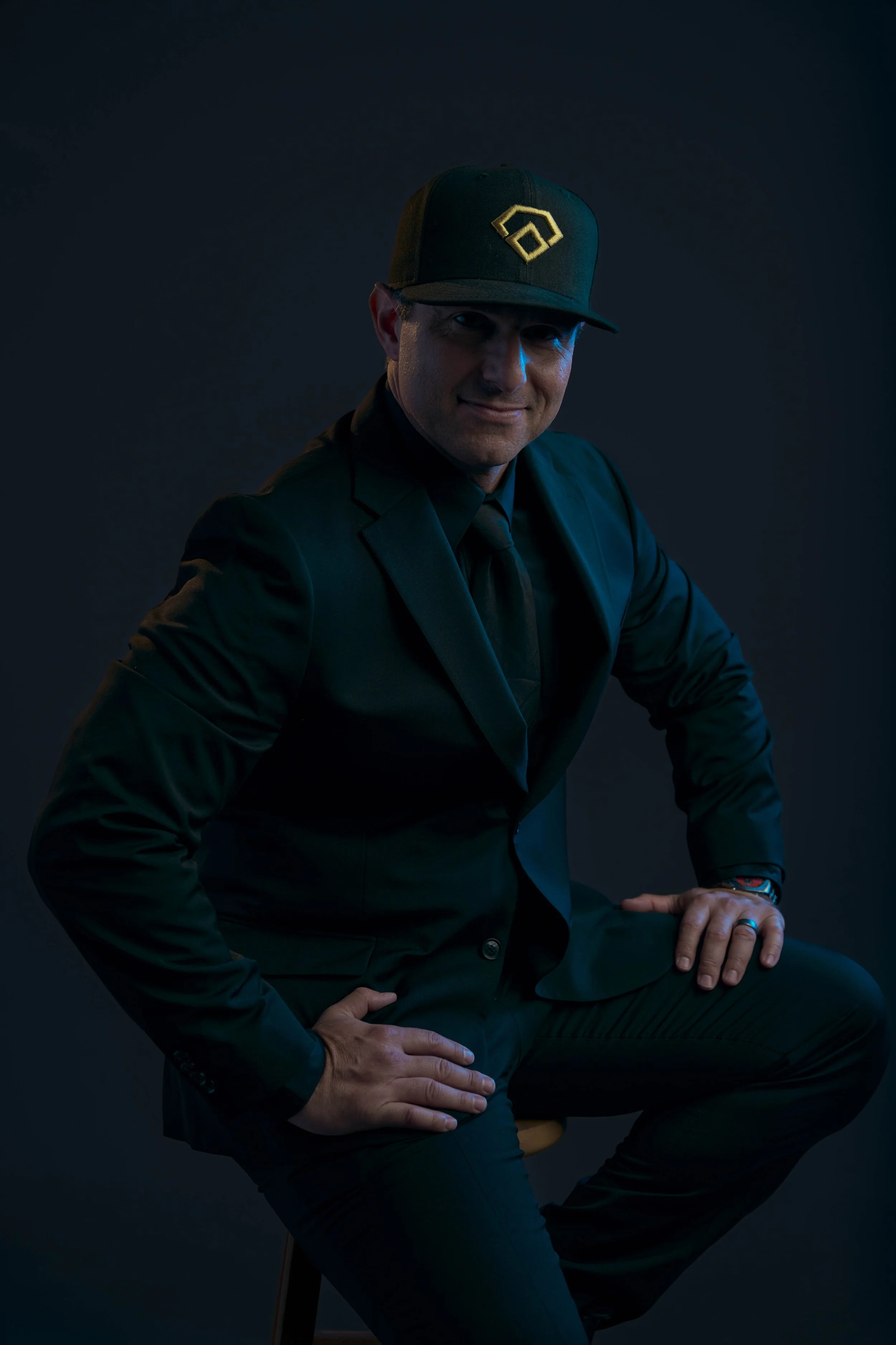 quinn-taplin-rc13-sports-suit-cap-seated.jpg