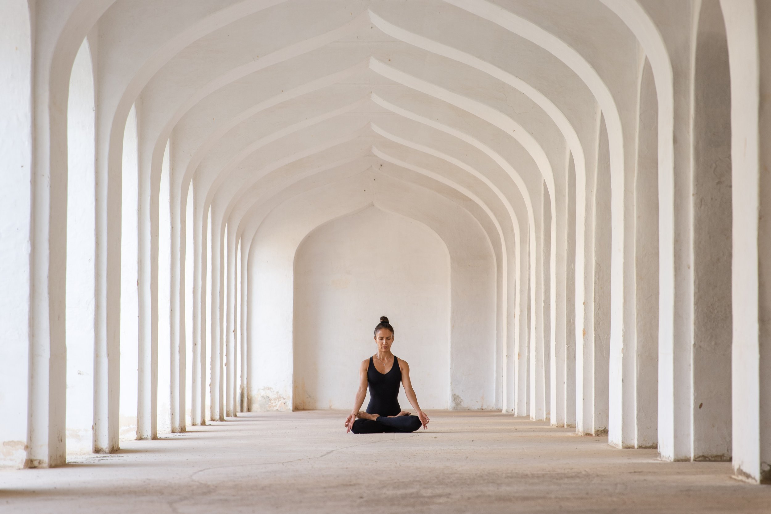 quinn-taplin-esmeralda-yoga-meditation-arched-hallway.jpg
