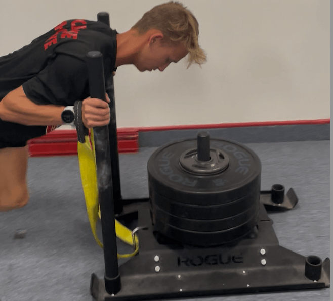 Athlete executing the training plan in the gym