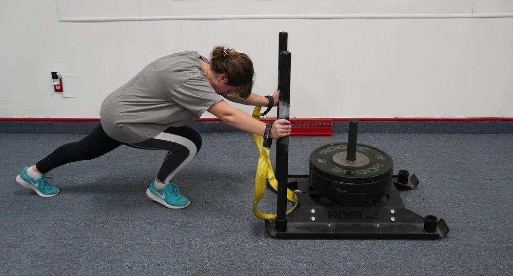 Client pushing a weighted sled