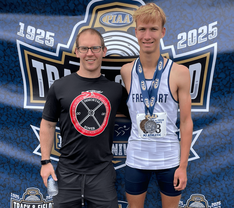 Coach Mike with an athlete after a win