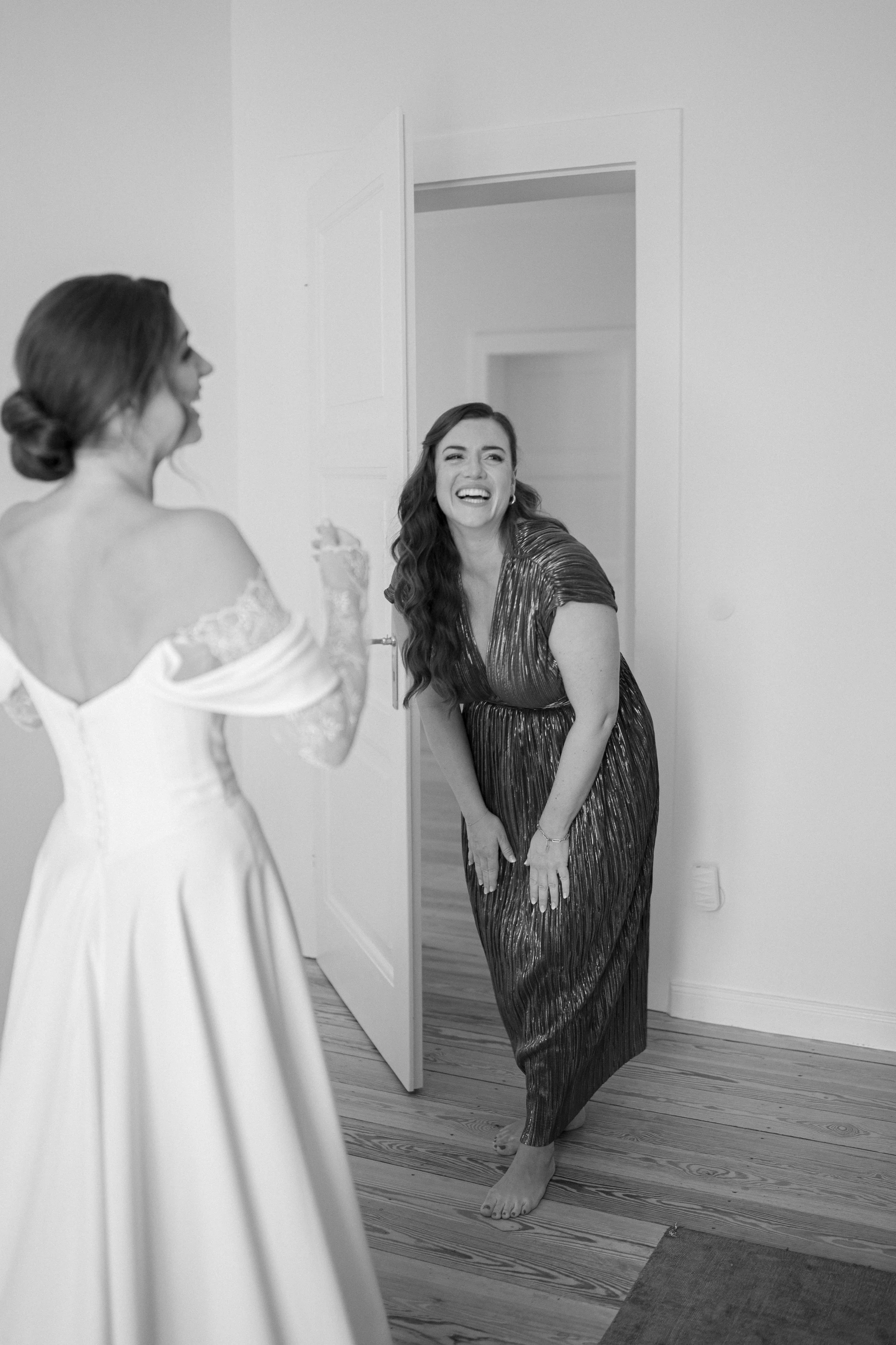 Bride and her sister laughing during the getting ready.