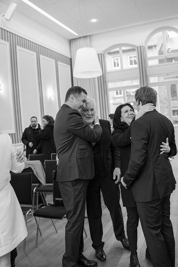 Family members hugging after the wedding ceremony. 