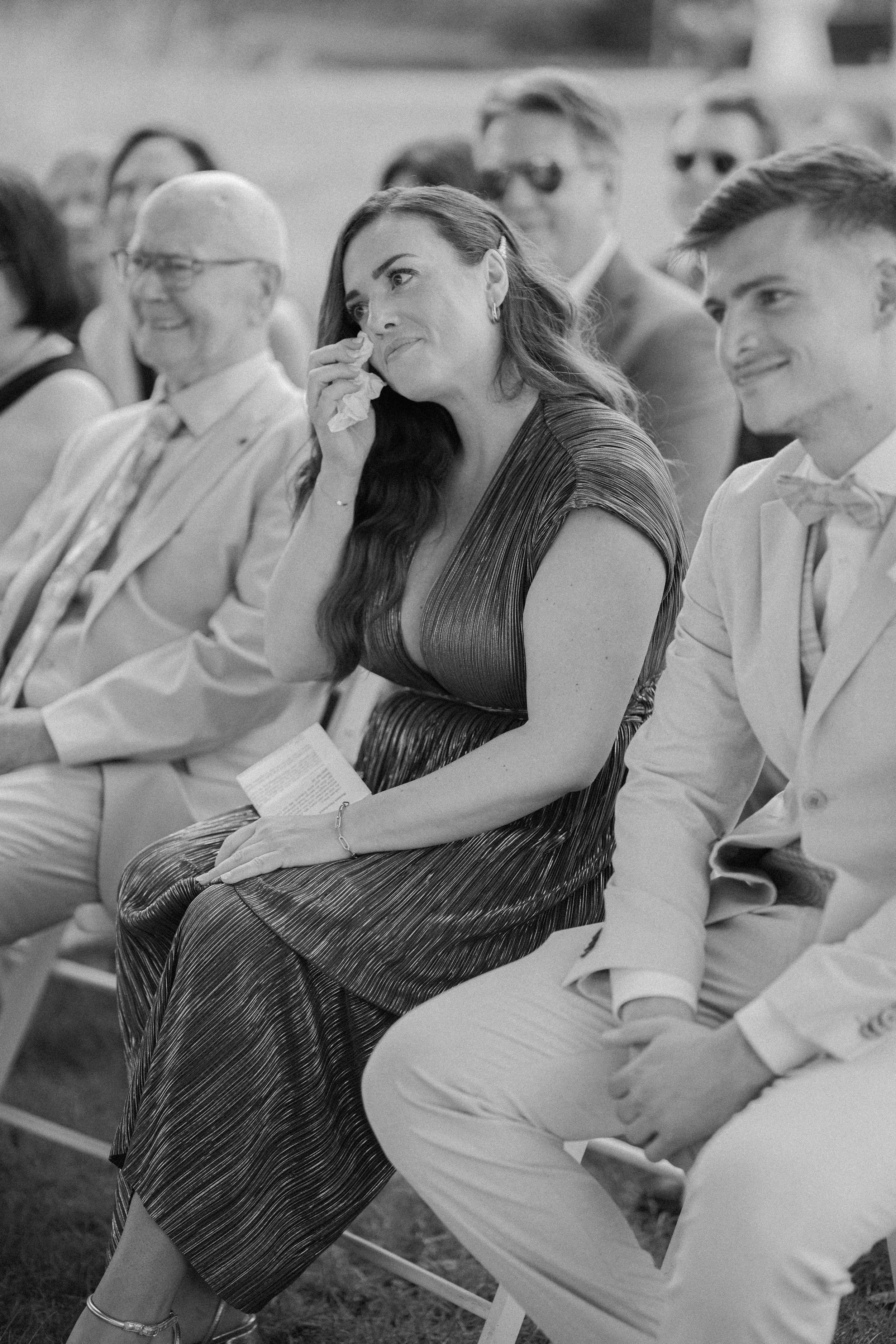 Sister of the bride is crying during the wedding ceremony