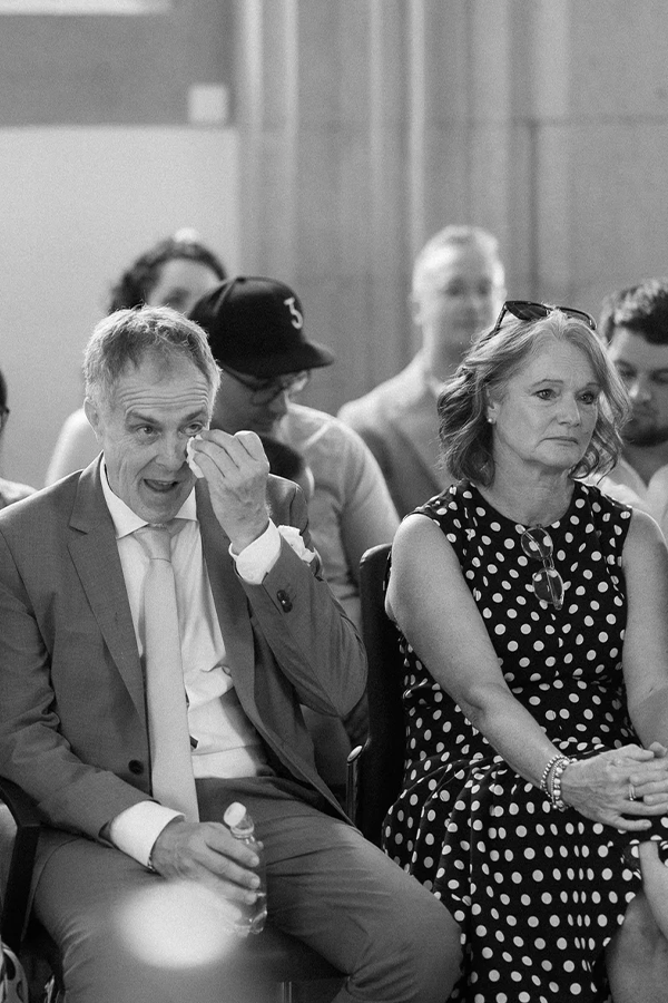 Father of the bride is getting emotional during the civil wedding.