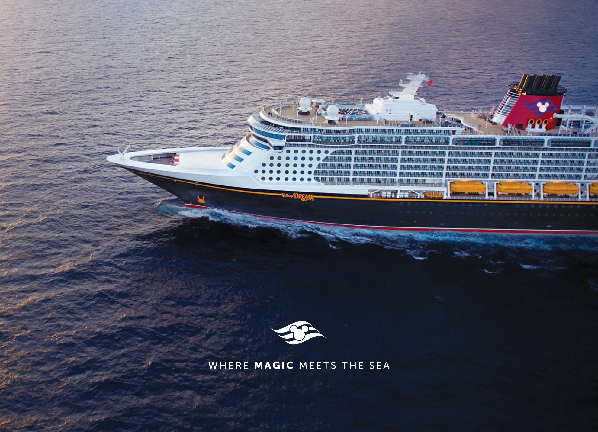 A large cruise ship sailing on the ocean at sunset, with the ship's name "Disney Dream" visible on the side and a stylized Disney logo on the funnel. The ship has multiple decks with windows and outdoor areas.