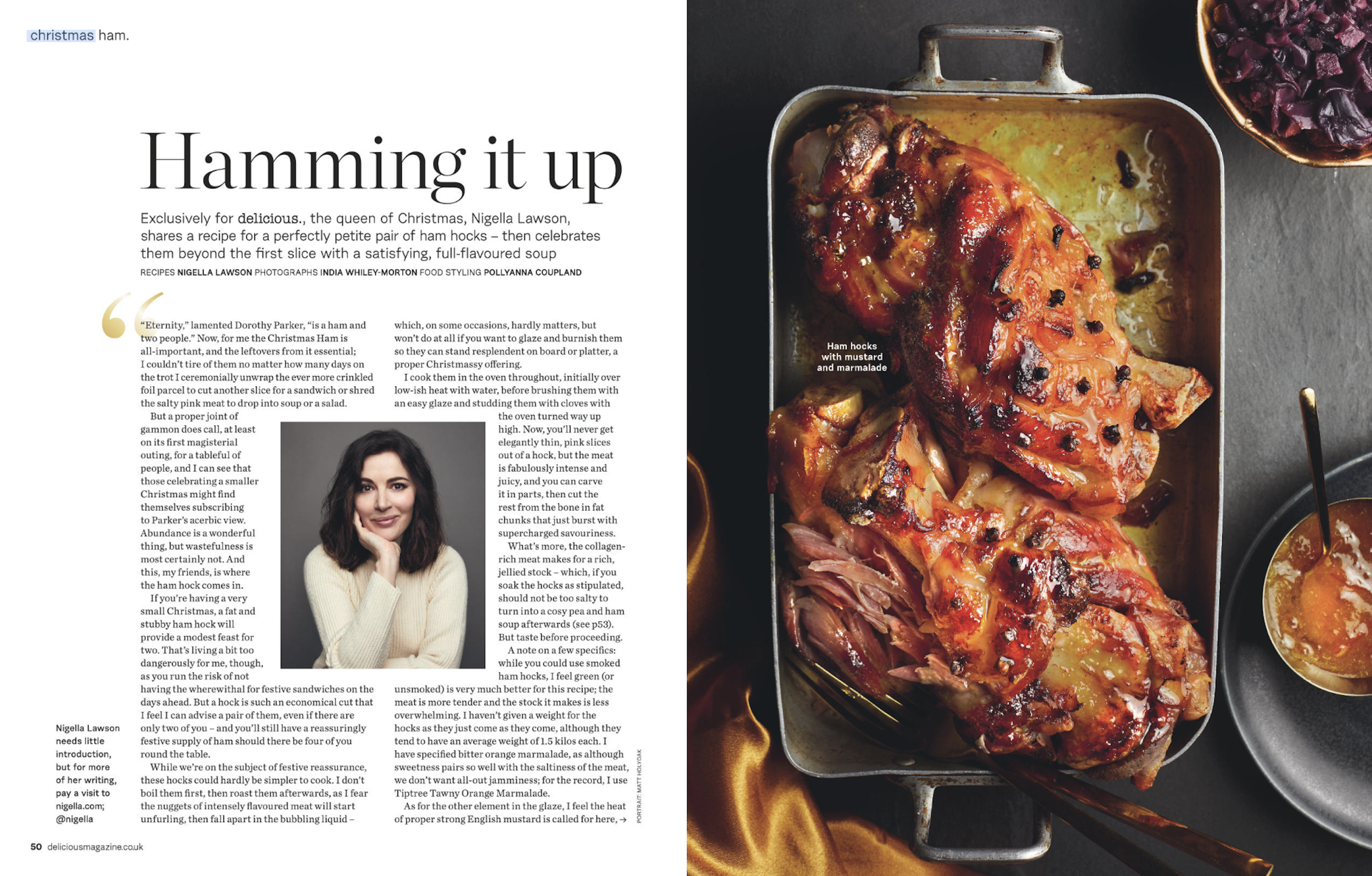 Baked ham hocks with mustard and marmalade in a roasting pan, garnished with cooked onions and herbs, with small bowls of fruit compote and sauce nearby.