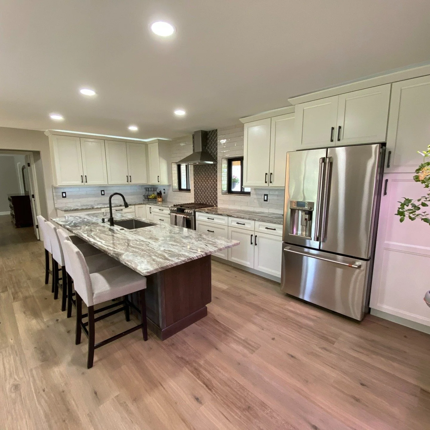 Before ➝ After: from dark + dated to bright + custom.
Took down all the walls. 
New shaker cabinets, jumbo island, under/over cab lighting, LVP floors, and loads of storage.
Had to delete and add a few windows to accommodate new layout.
St. Pete/Tamp