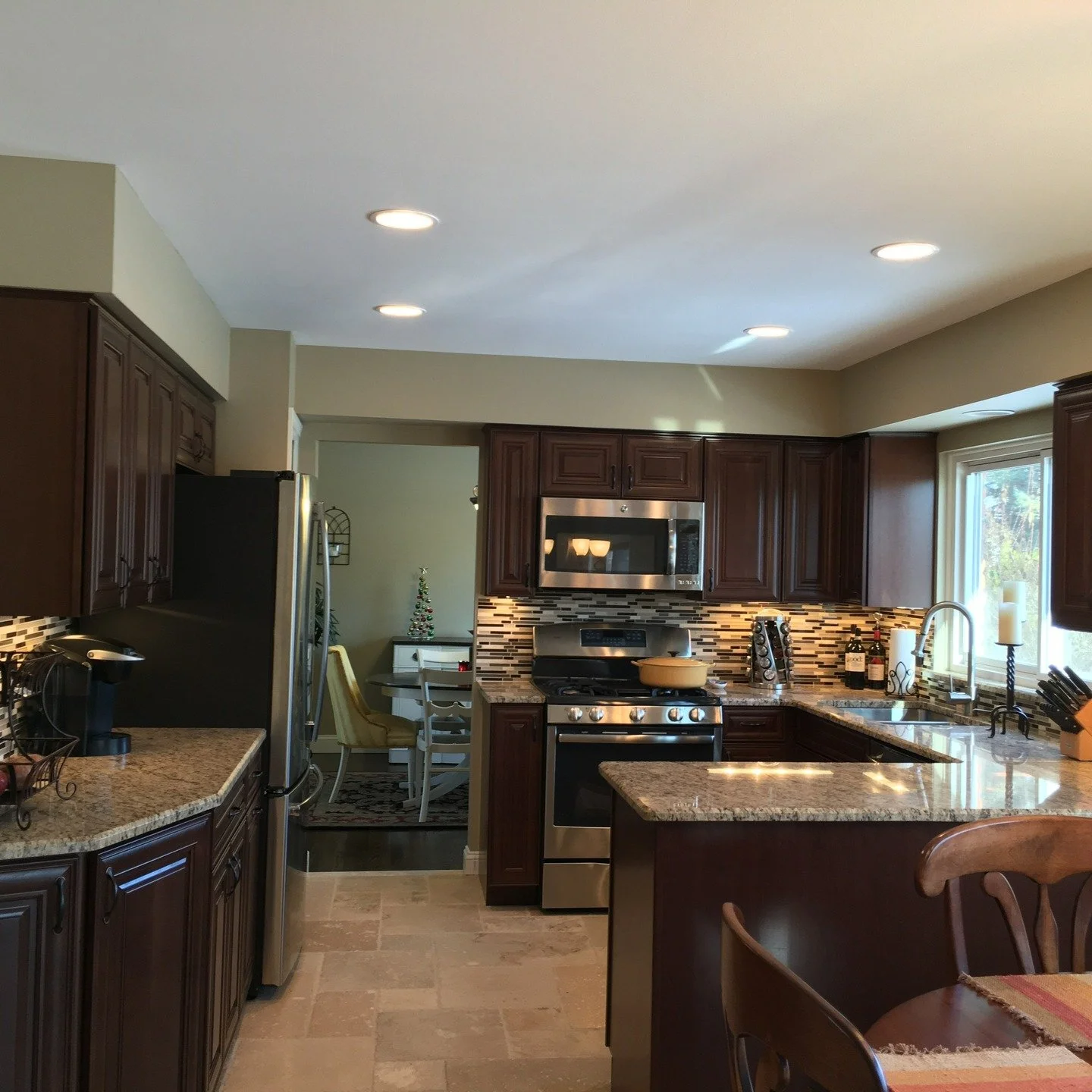 From tired to timeless. ✨
Swipe to see this dated kitchen become a warm, functional cook space with fresh cabinetry, granite tops, a glass mosaic splash, stainless appliances, new lighting, and a durable stone floor.

Serving St. Pete / Tampa Bay&mda