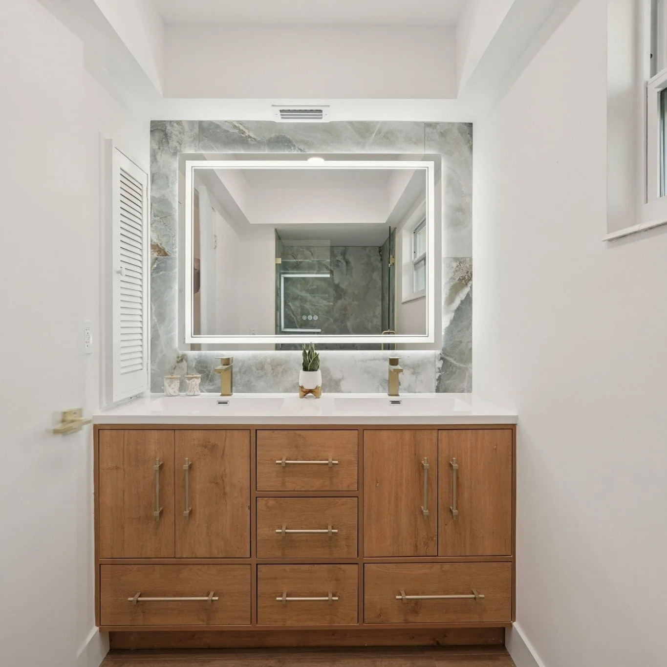 Hard to believe this is the same bathroom.
From studs and subfloor&hellip;
to spa-level finish.
Custom glass. Statement tile. Warm wood vanity.
This is what a full gut renovation looks like.
Swipe to see where it started. ➡️
#beforeandafter #bathroom