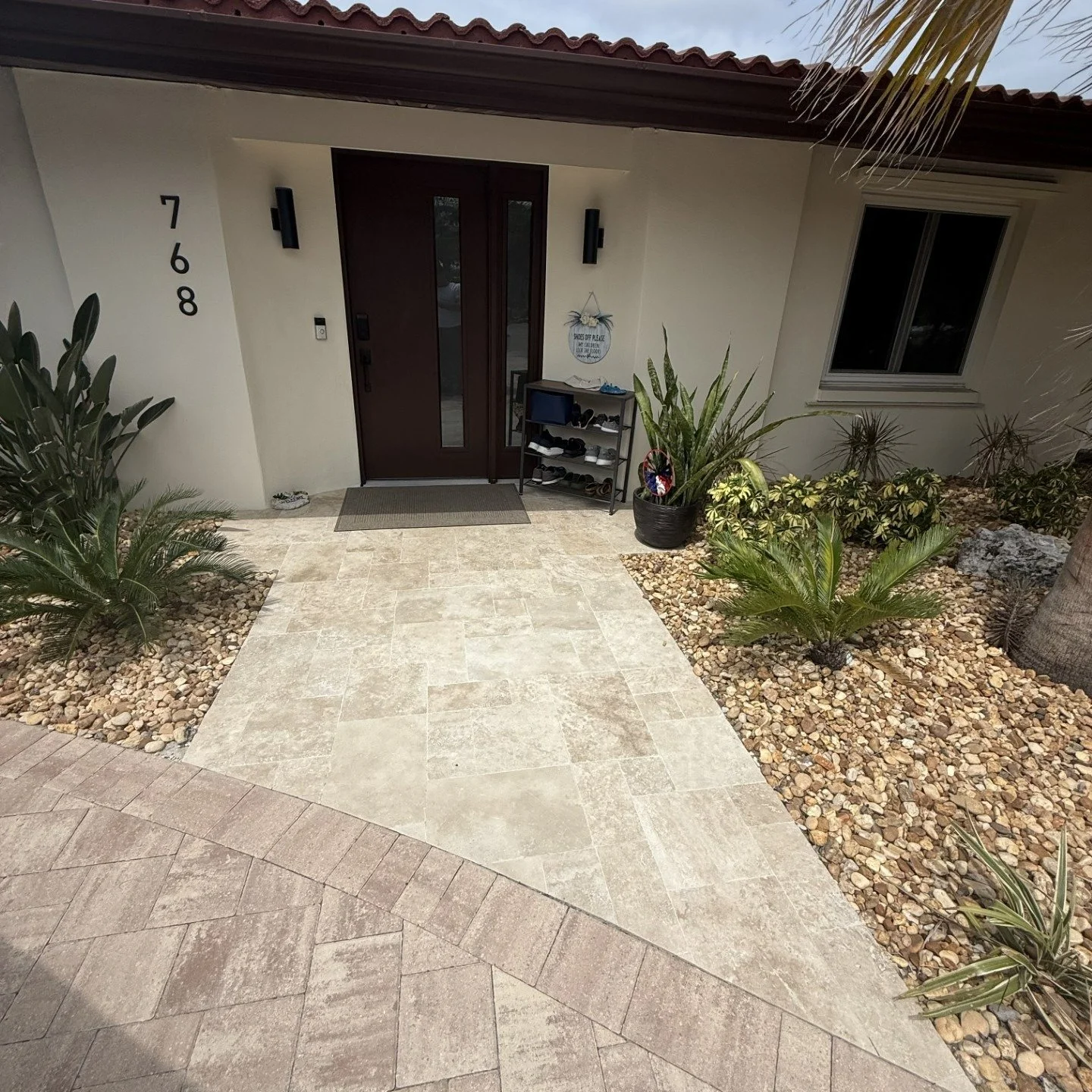 A new front entry can completely change the feel of a home.

✔️ Modern impact front door
✔️ New paver driveway and walkway
✔️ Fresh stucco finish
✔️ Updated lighting and house numbers
✔️ Low-maintenance tropical landscaping

The difference is more th