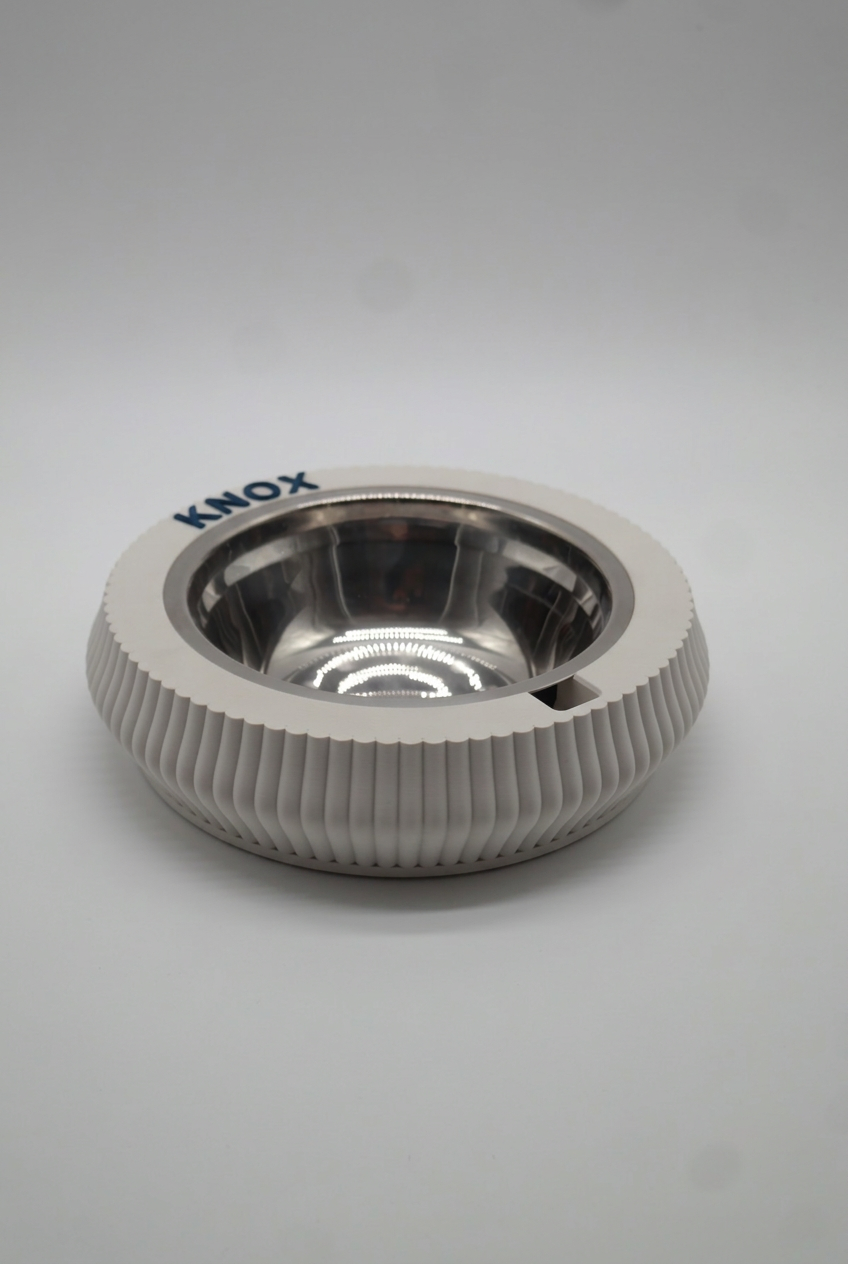 Bone White KAZE pet bowl at an angle, with the name KNOX in raised dark blue letters on the rim.