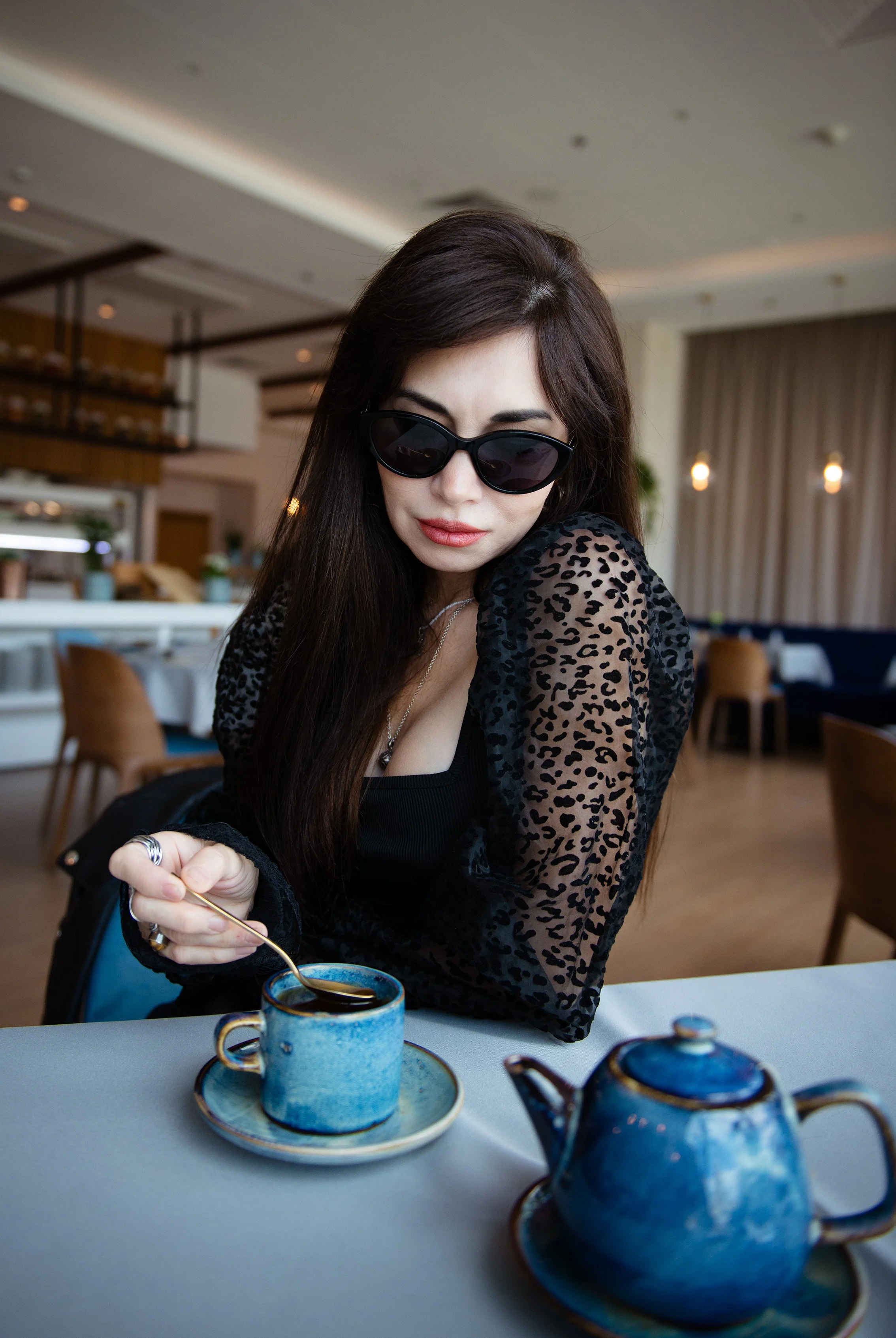 woman-black-outfit-cafe-portrait-photoshoot-amsterdam.jpg.jpg